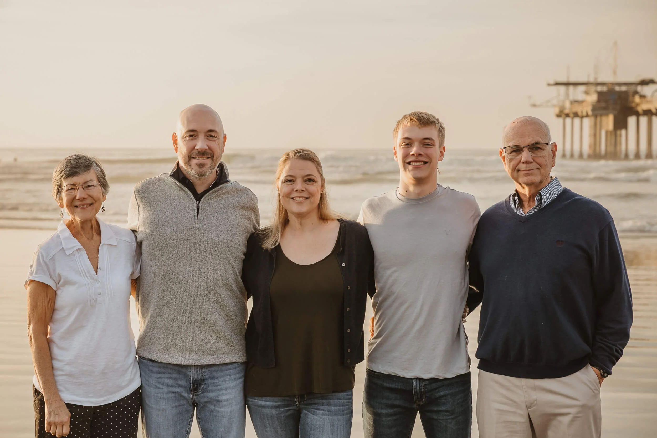 Closeup family and grandparents looking at camera for La Jolla Shores and Scripps Pier Family Photography in San Diego