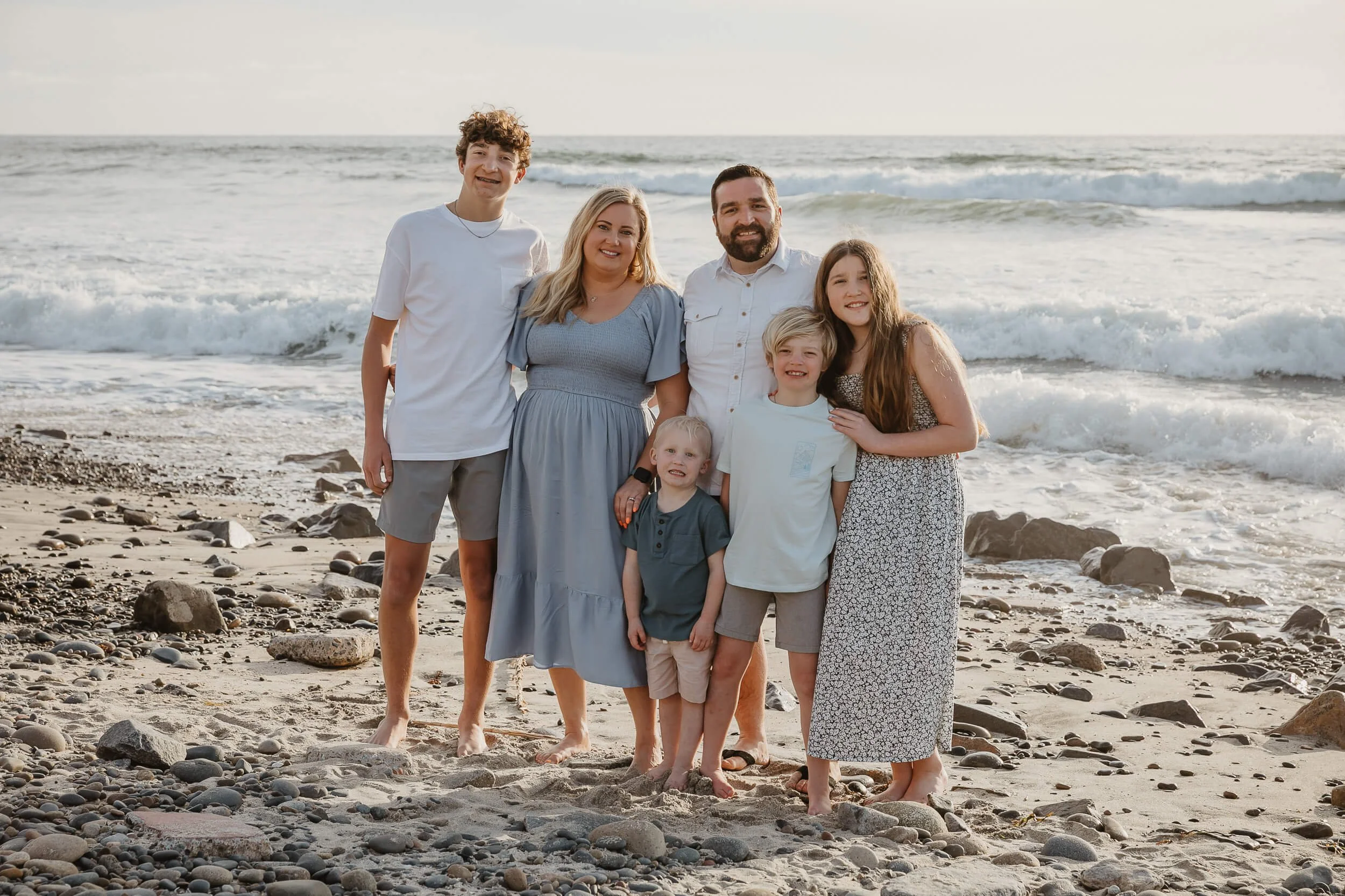 Large family portrait by the ocean photographed during a Carlsbad Beach Family Photography Session