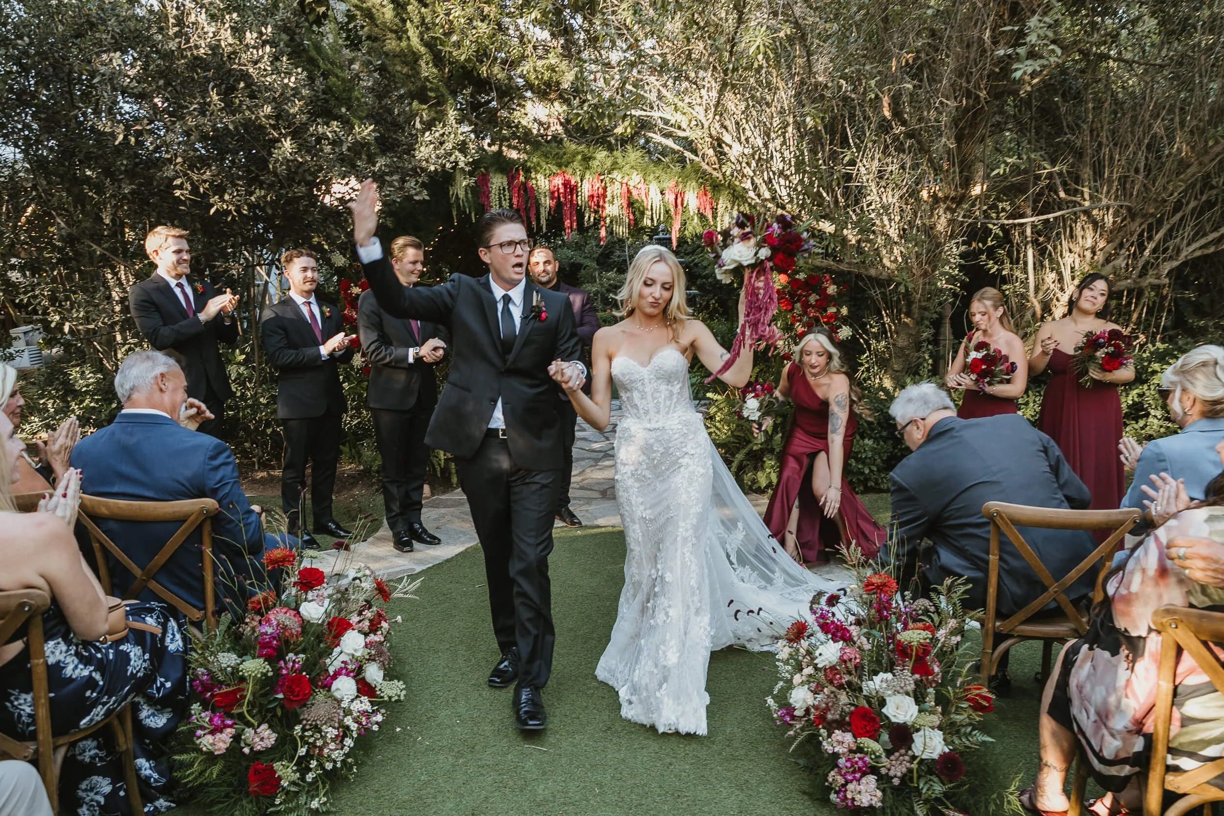 Newly married couple walking down aisle at Twin Oaks House & Gardens Estate Wedding
