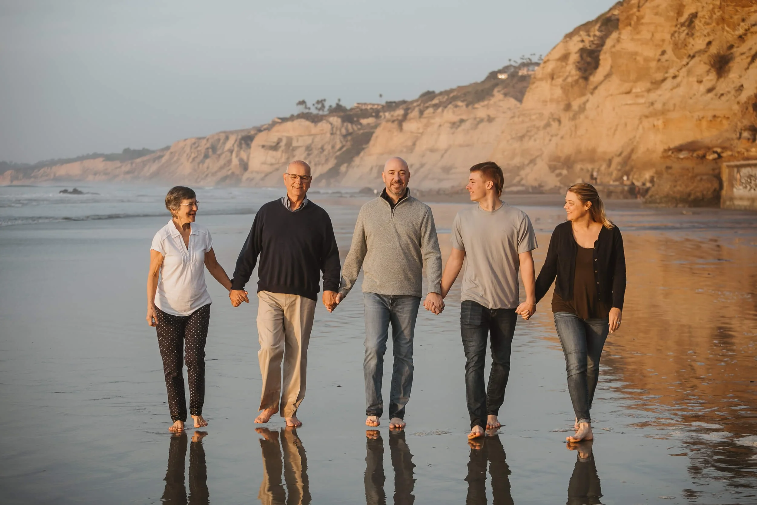 San Diego photography mini session candid family looking at each other at La Jolla Shores photo session