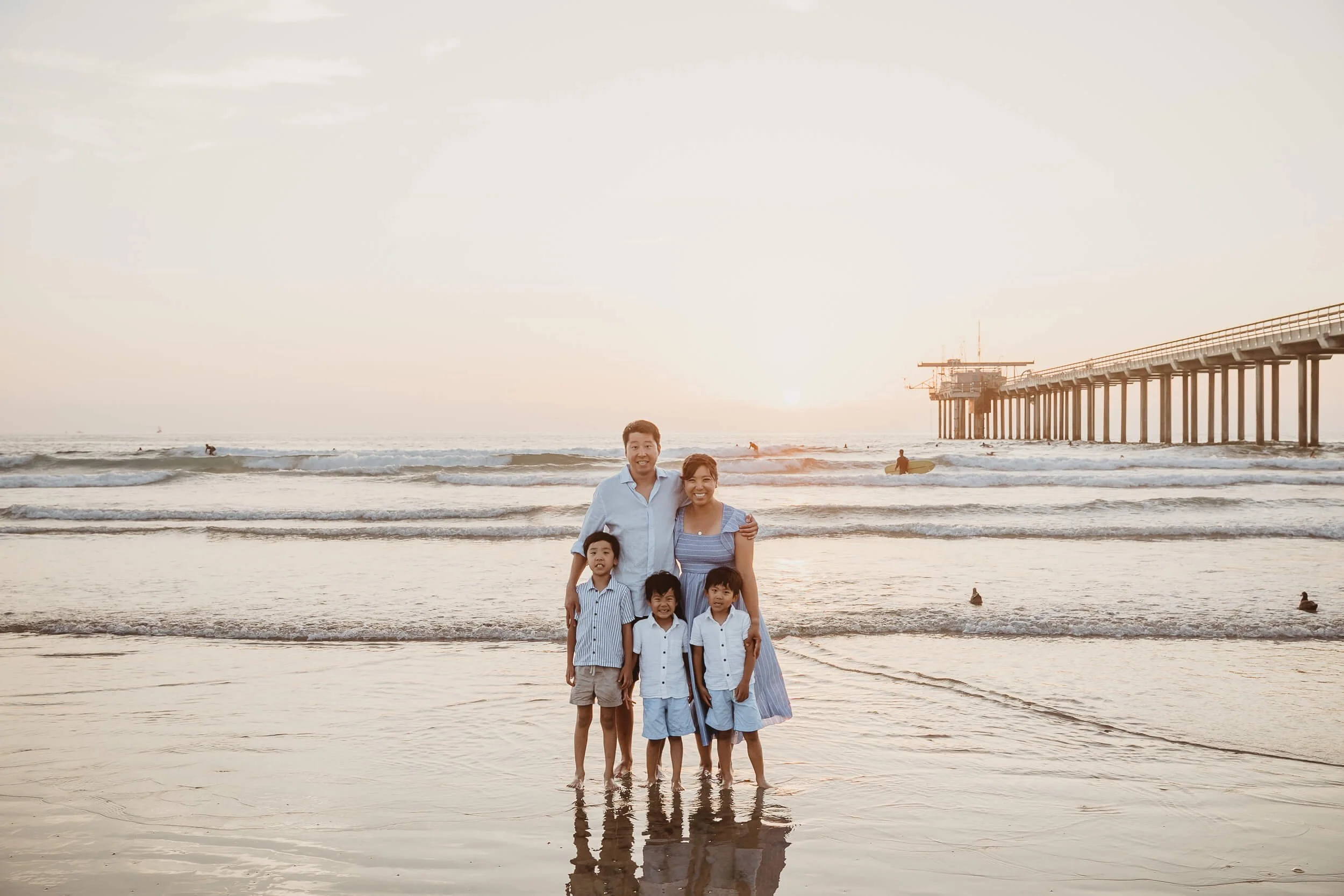 San Diego holiday mini sessions family of five posing together at La Jolla Shores sunset session 