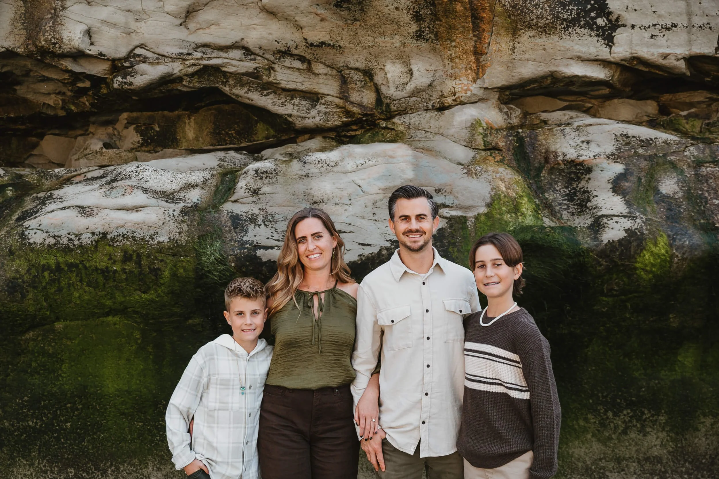 Family portrait near coastal cliffs during a Carlsbad Beach Family Photography Session