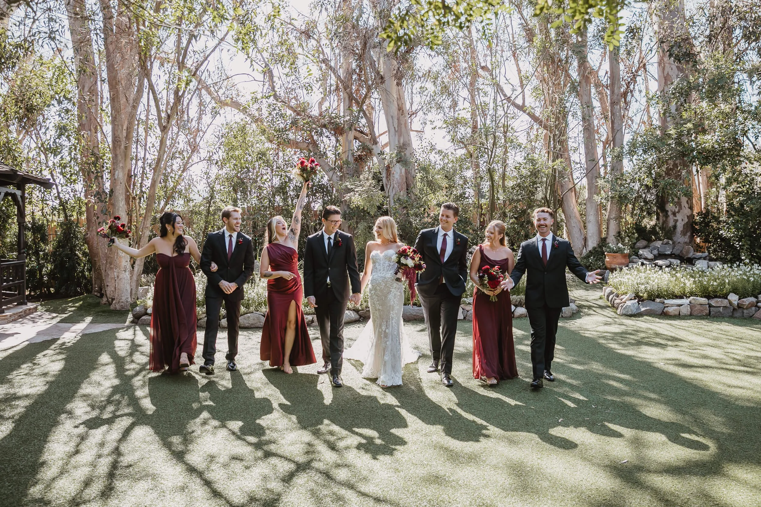 Wedding party walking portrait at Twin Oaks House & Gardens Estate Wedding photographed by Carlsbad wedding photographer