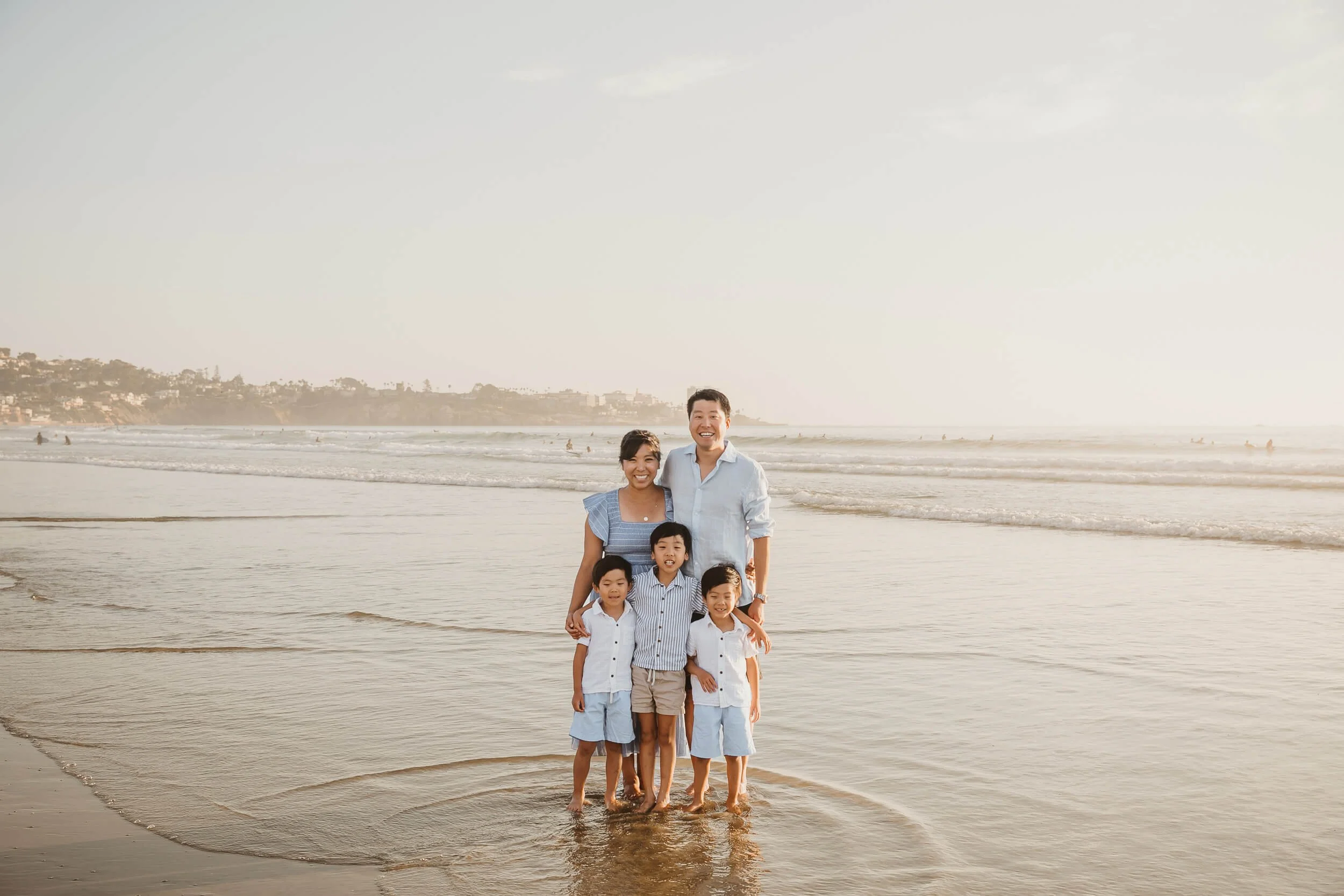 La Jolla family photography session family of five posing with La Jolla Shores in background in San Diego photo session