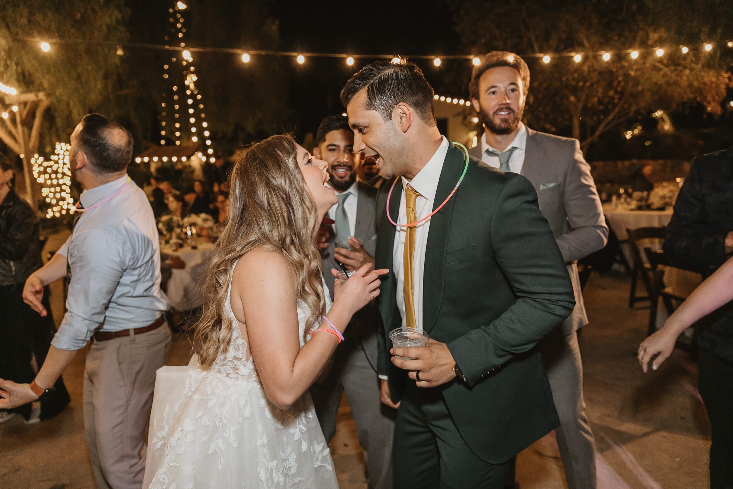 Fun candid photography bride and groom having fun after their Leo Carillo Ranch Wedding