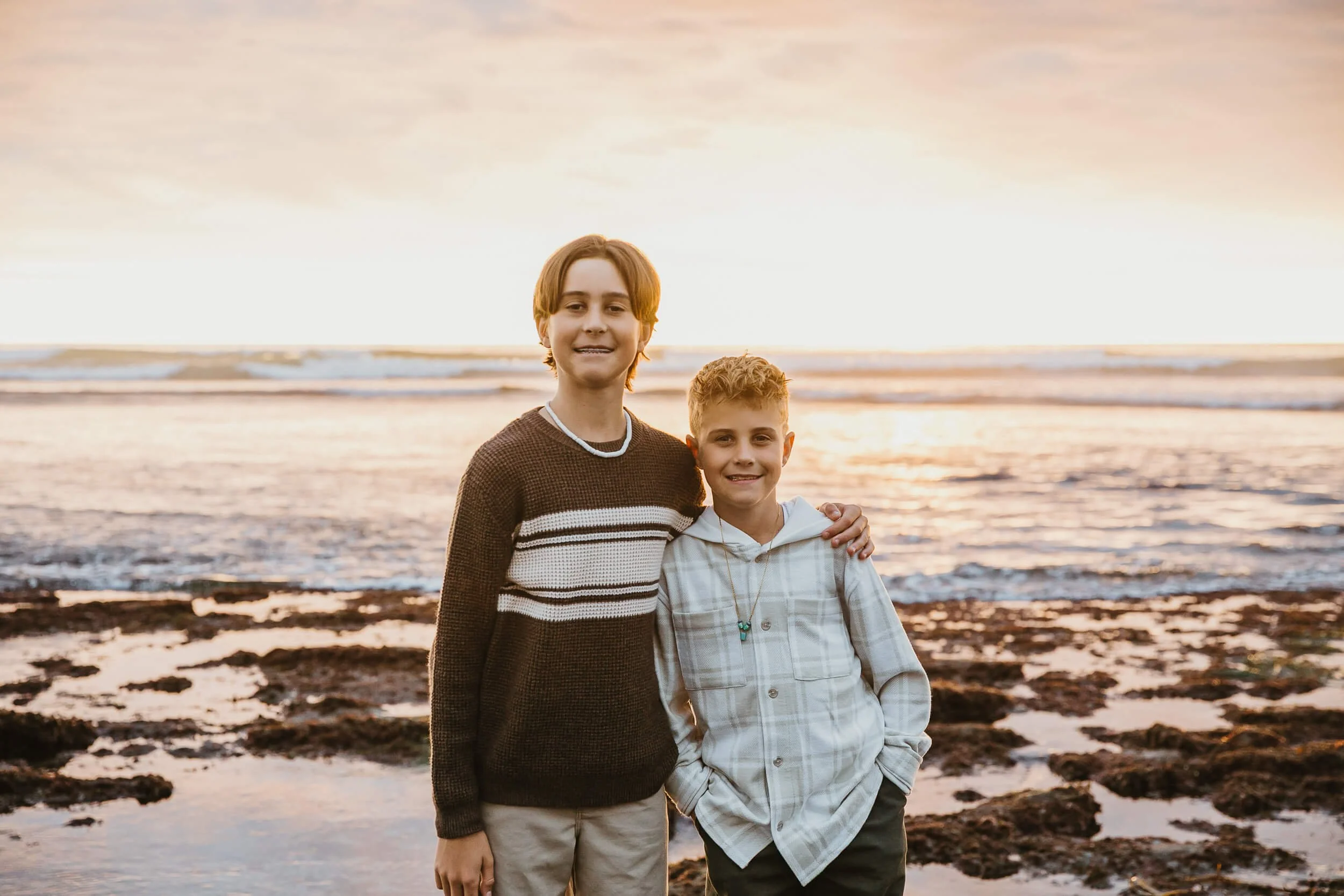 Brothers portrait during sunset at the beach in Carlsbad, California