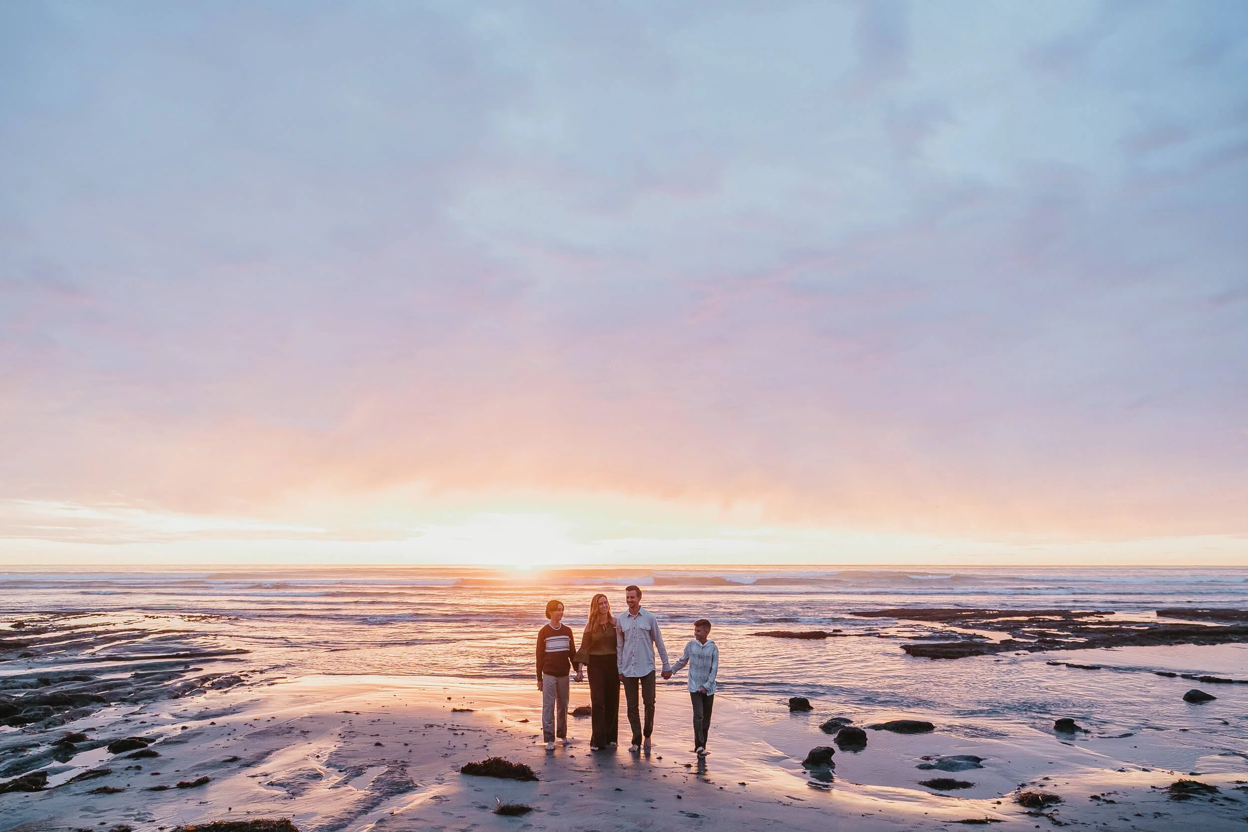 Wide sunset beach family portrait during a Carlsbad Beach Family Photography Session