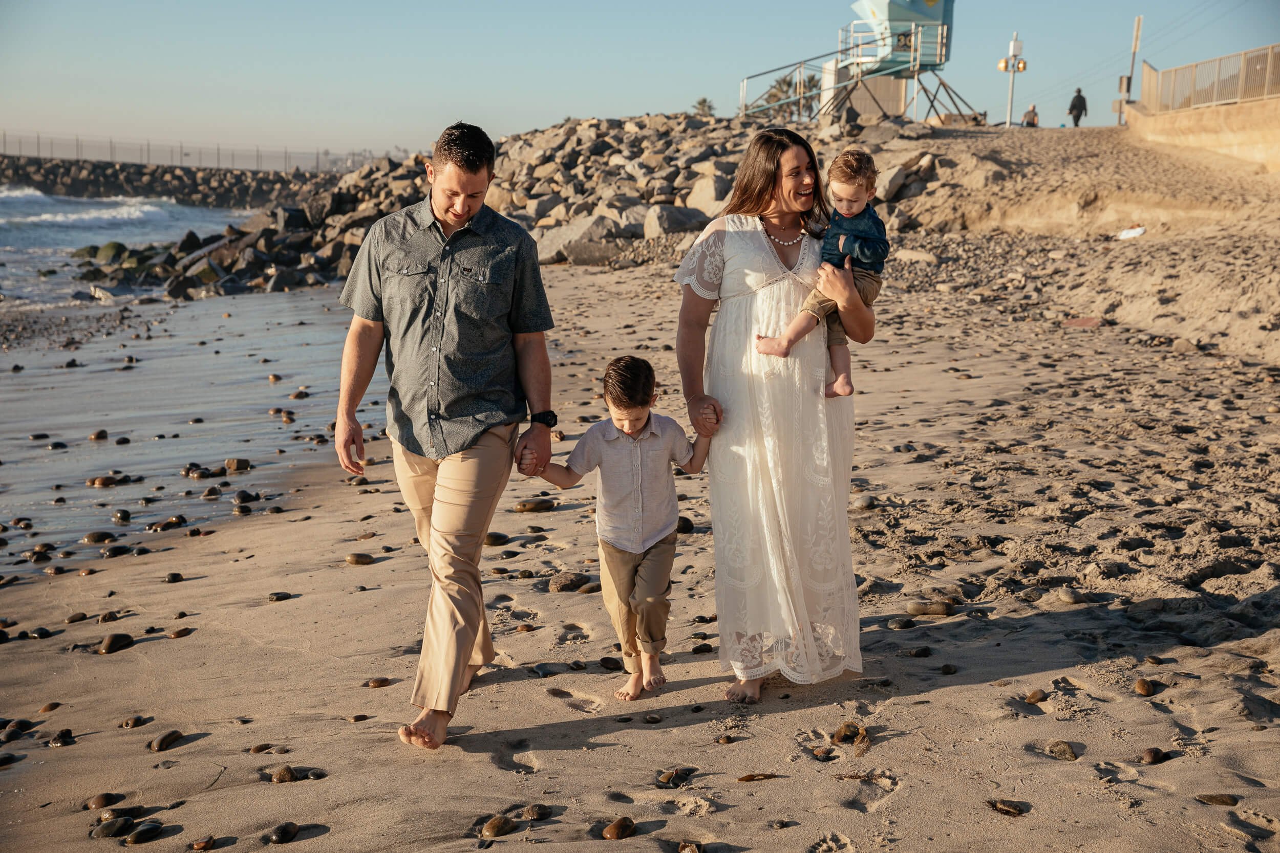 Family walking on the beach during a relaxed Carlsbad Beach Family Photography Session