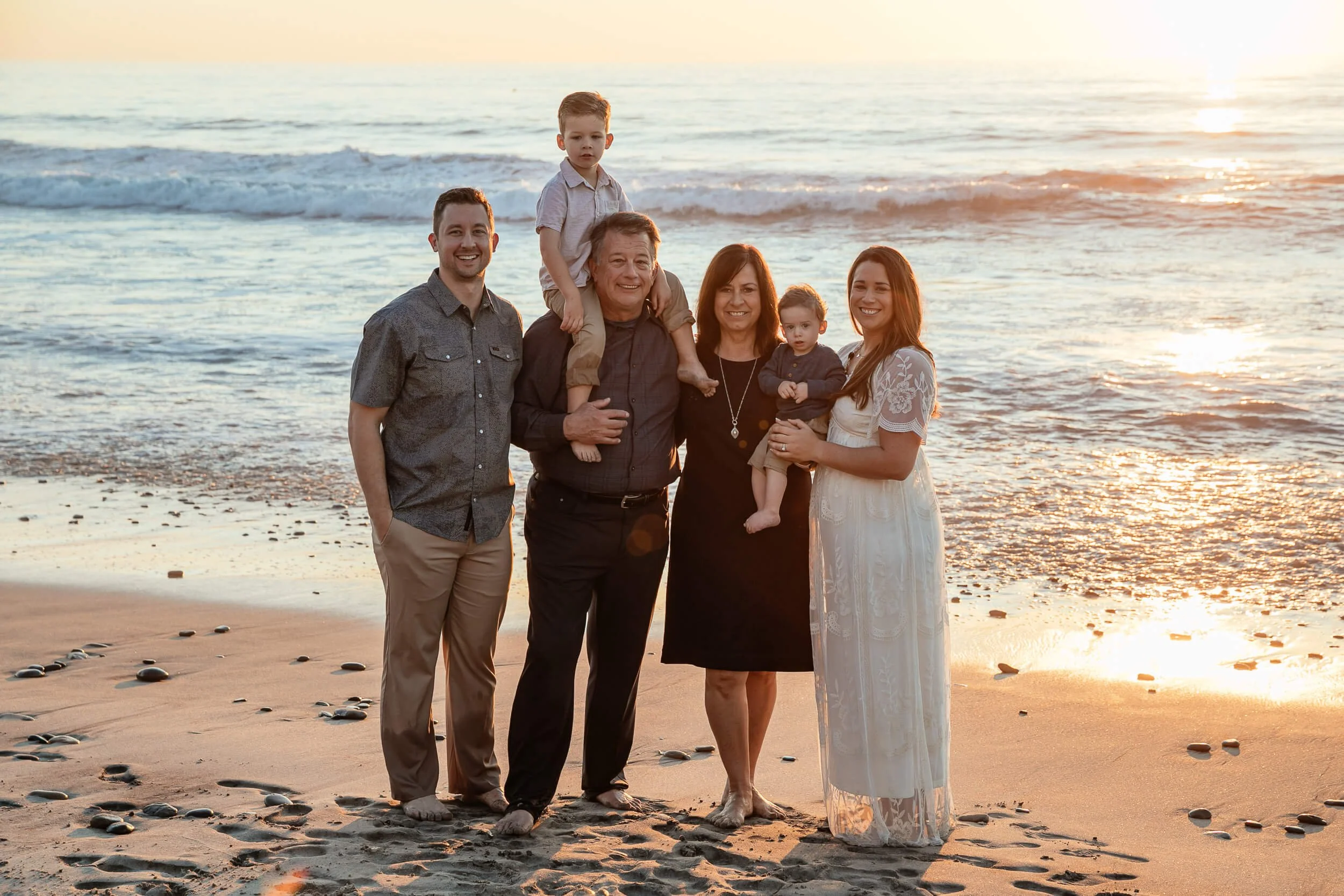 Sunset family beach photography session in Carlsbad, California with ocean background