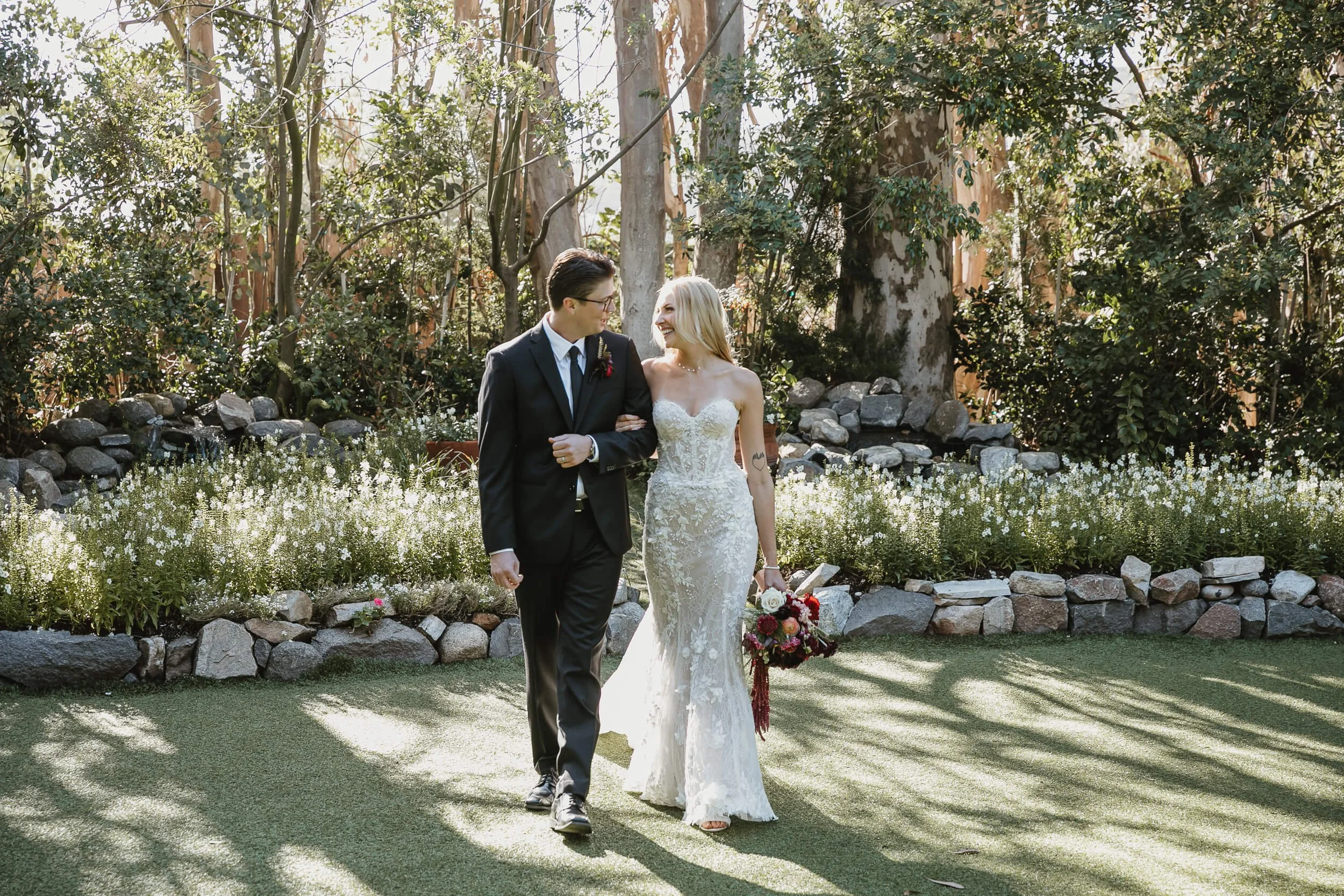 Bride and groom walking together at Twin Oaks House & Gardens Estate Wedding venue