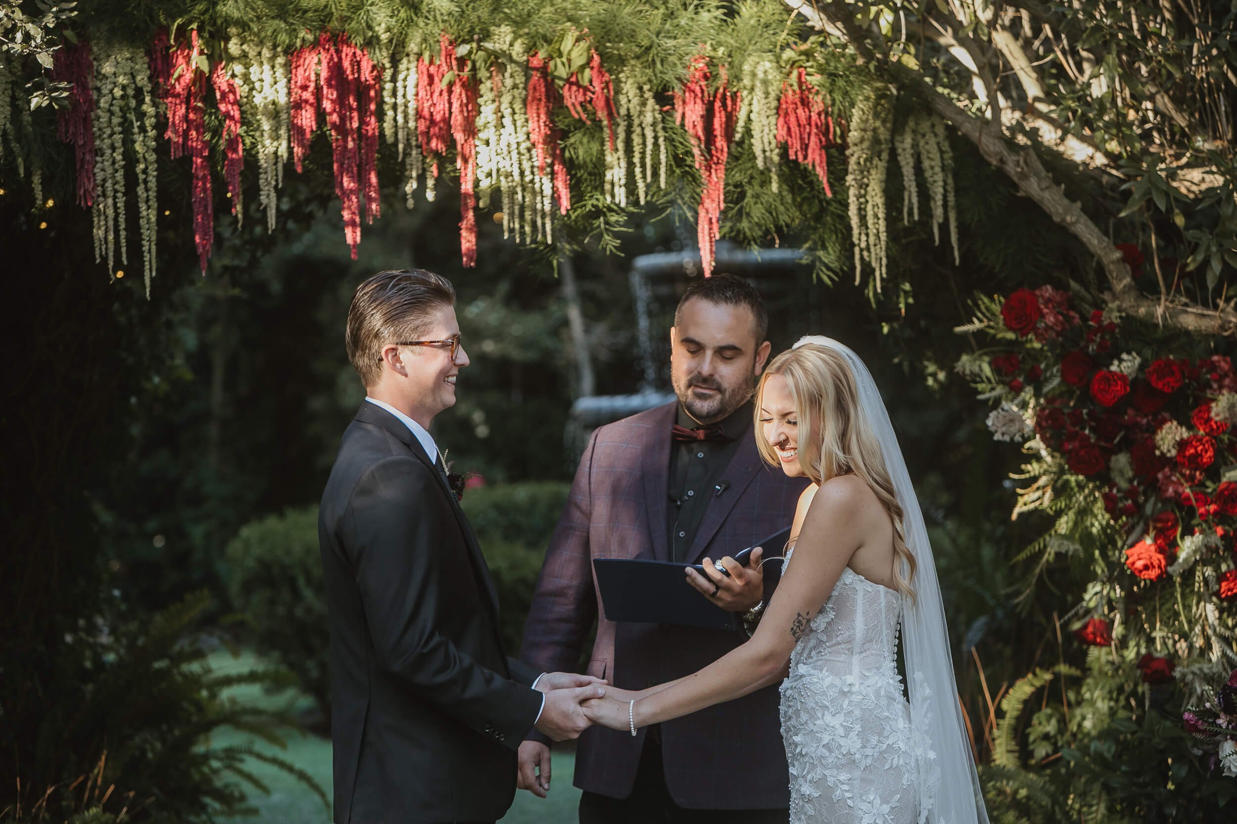 Couple holding hands during Twin Oaks House & Gardens Estate Wedding ceremony