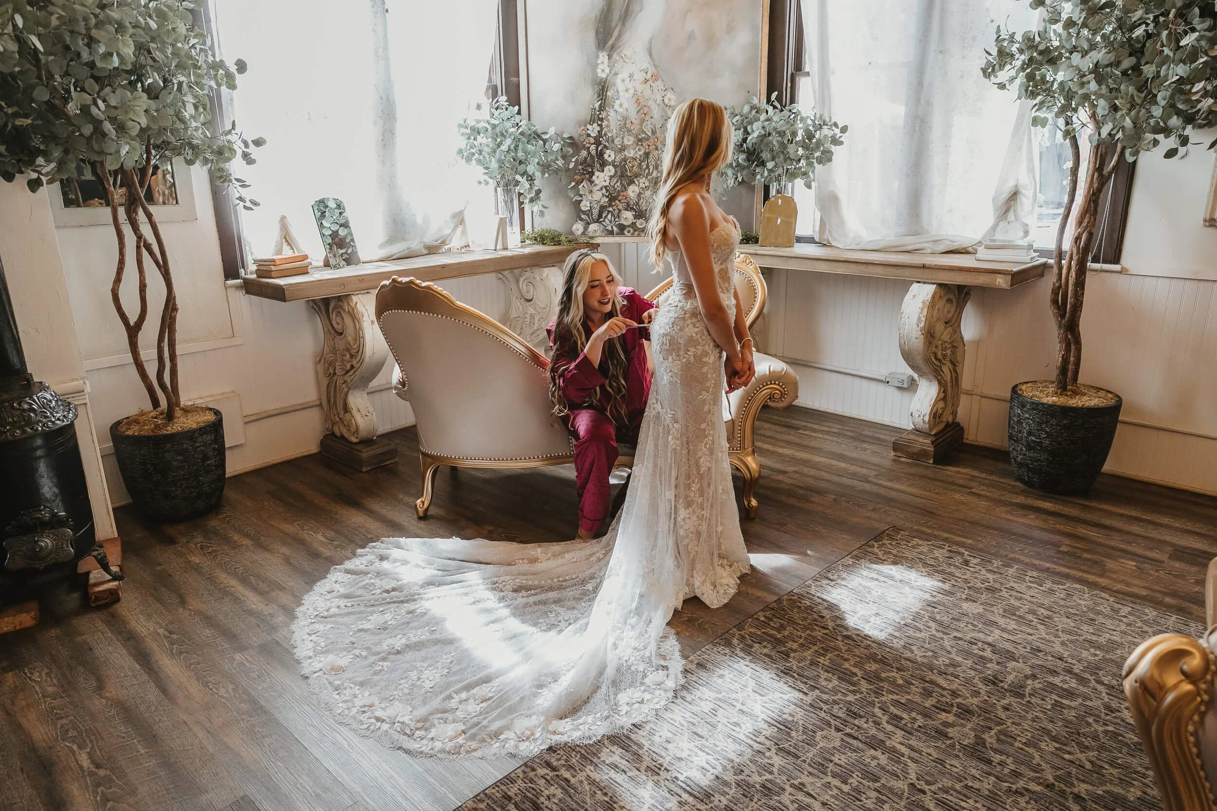 Bride preparing wedding dress at Twin Oaks House & Gardens Estate Wedding venue