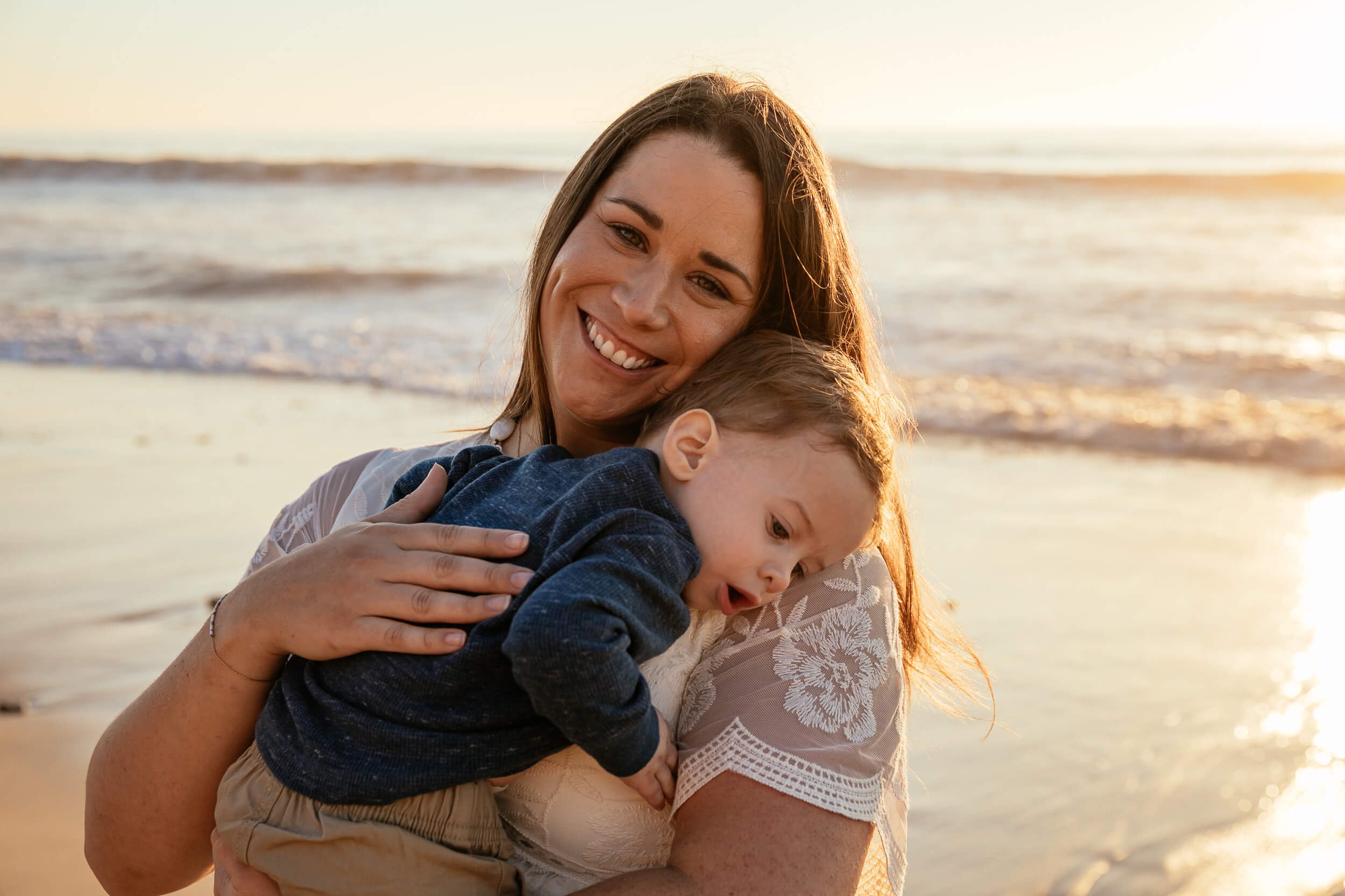 Close-up candid mother and child portrait during a Carlsbad Beach Family Photography Session