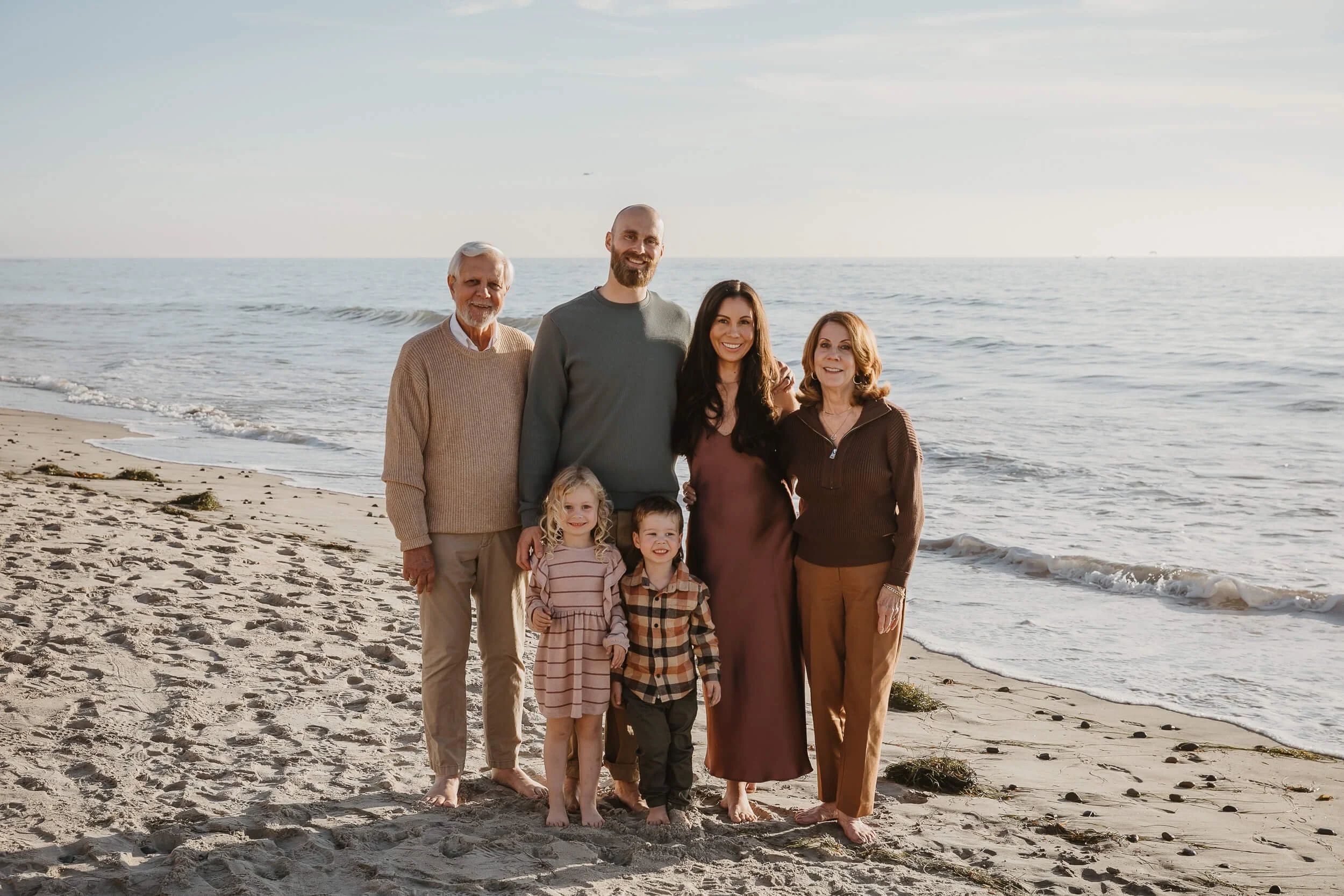 Family portrait during a sunset at the beach in Southern California – Carlsbad Beach Family Photography Sessions by a Carlsbad wedding photographer