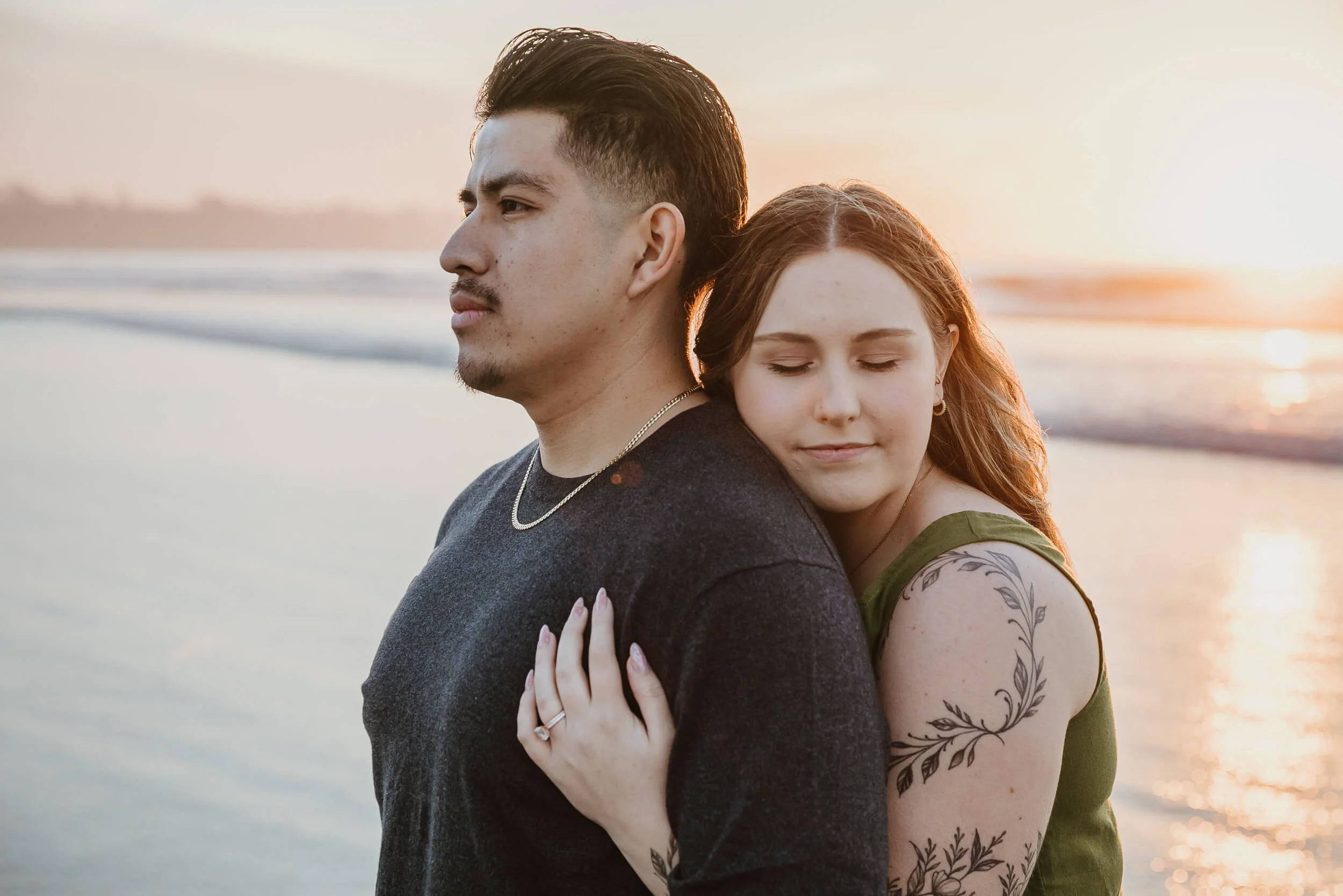 Artistic pose couple looking away during amazing sunset at La Jolla Shores and Scripps Pier Family Photography mini session in San Diego