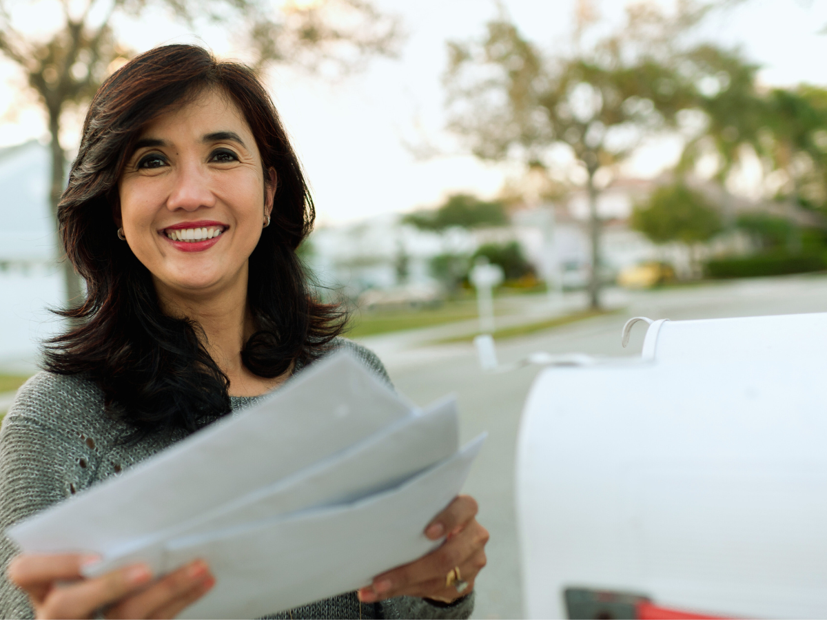 Direct mail works-customer holding direct mail