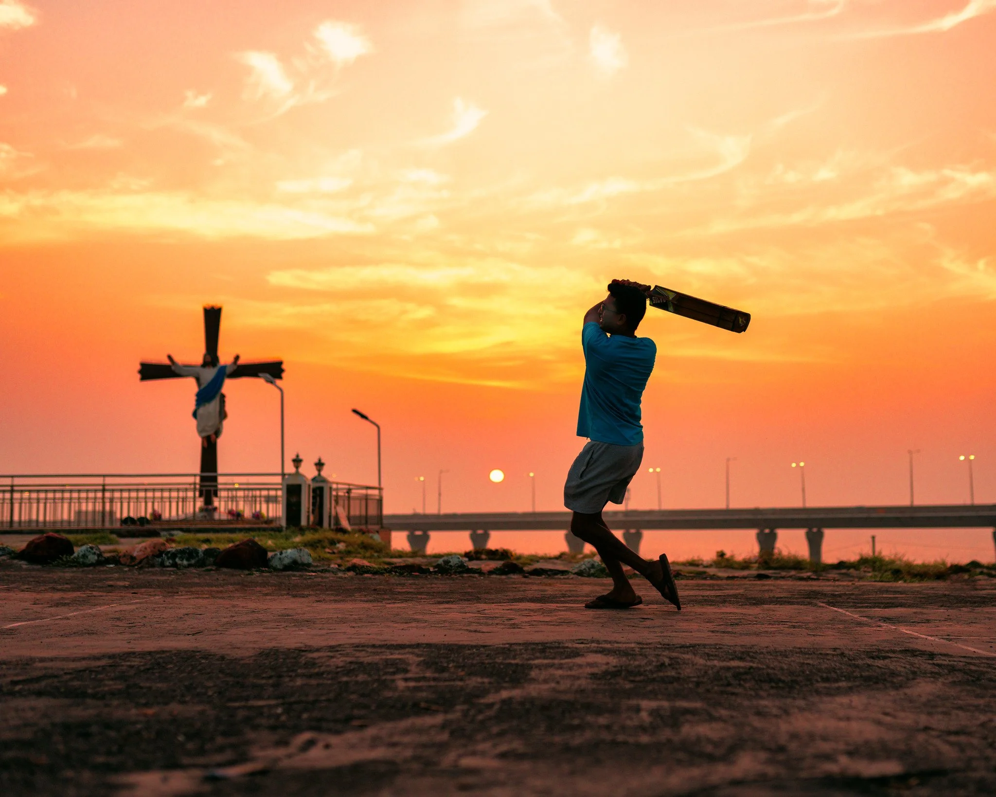 A cricket player at Worli Village, by Craig Boehman.