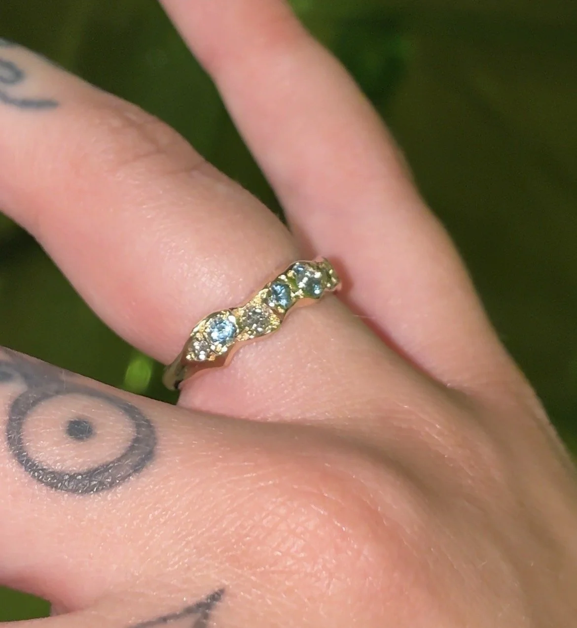 Uranus Ring gold - A molten gold ring with aquamarine and salt and pepper diamonds