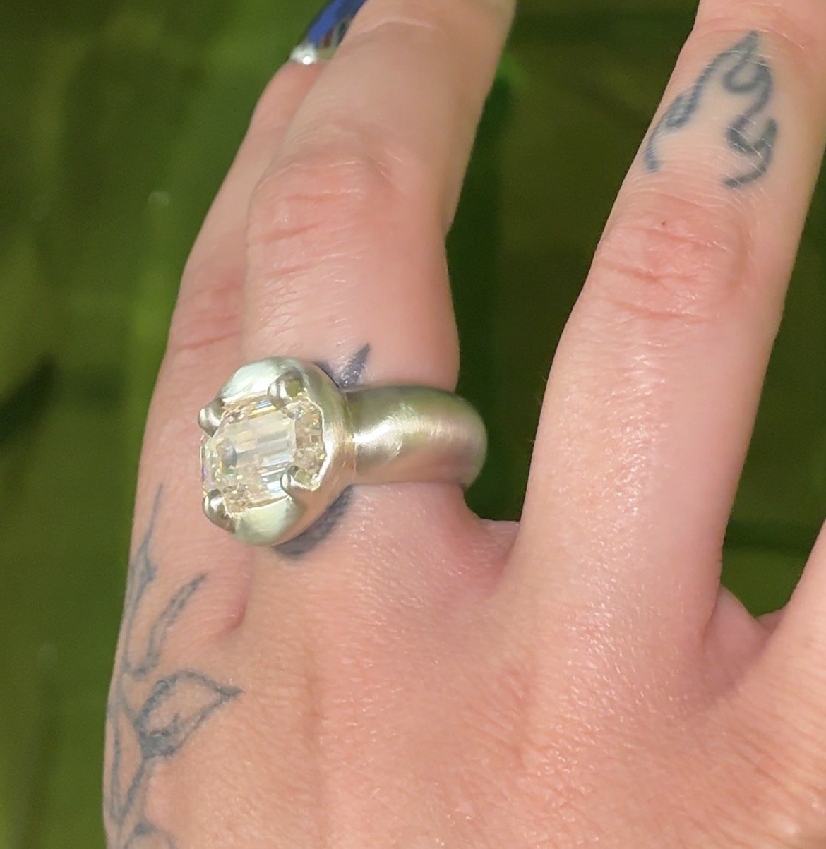 Uranus statement ring - a white gold puffy ring with an emerald cut moissanite in the centre