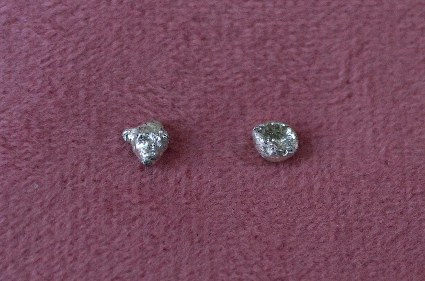 Textured sterling silver studs. The studs are mismatched