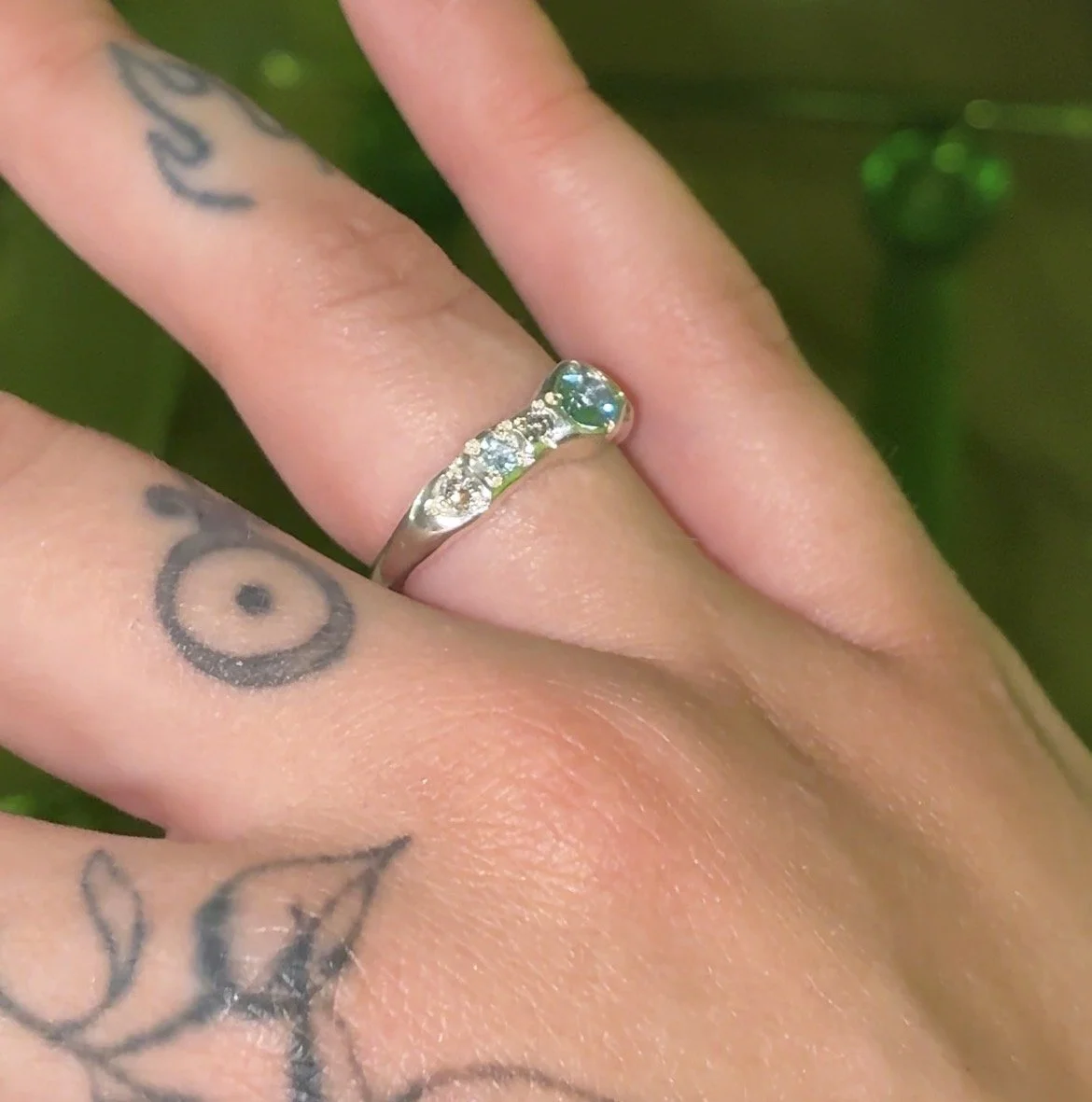 Uranus Ring silver - A molten silver ring with aquamarine and salt and pepper diamonds