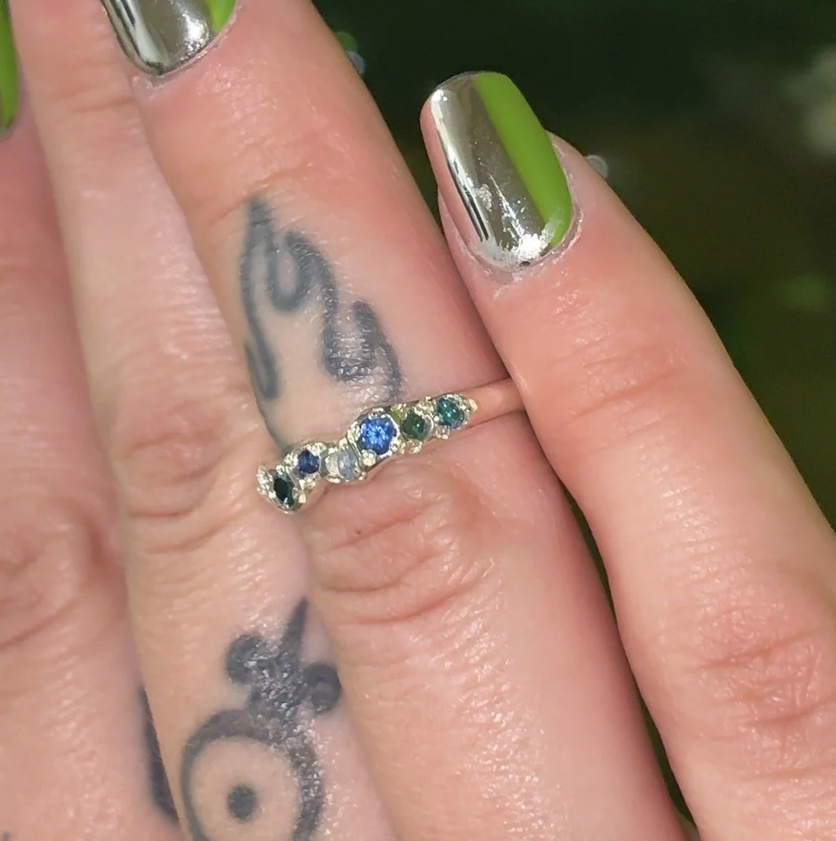 Neptune band silver - A silver molten band with blue topaz, blue diamonds and blue sapphire