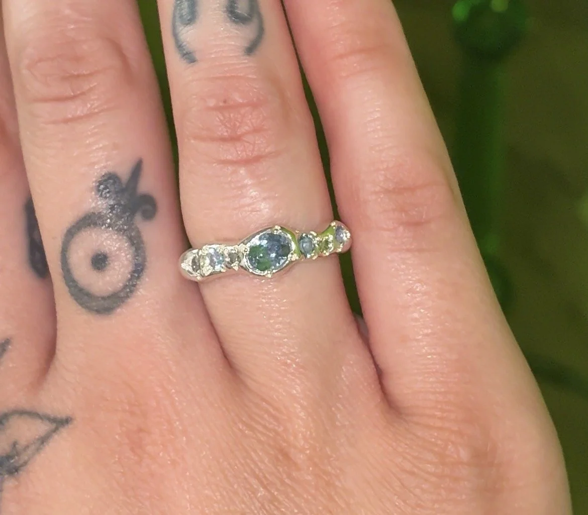 Uranus Ring silver - A molten silver ring with aquamarine and salt and pepper diamonds