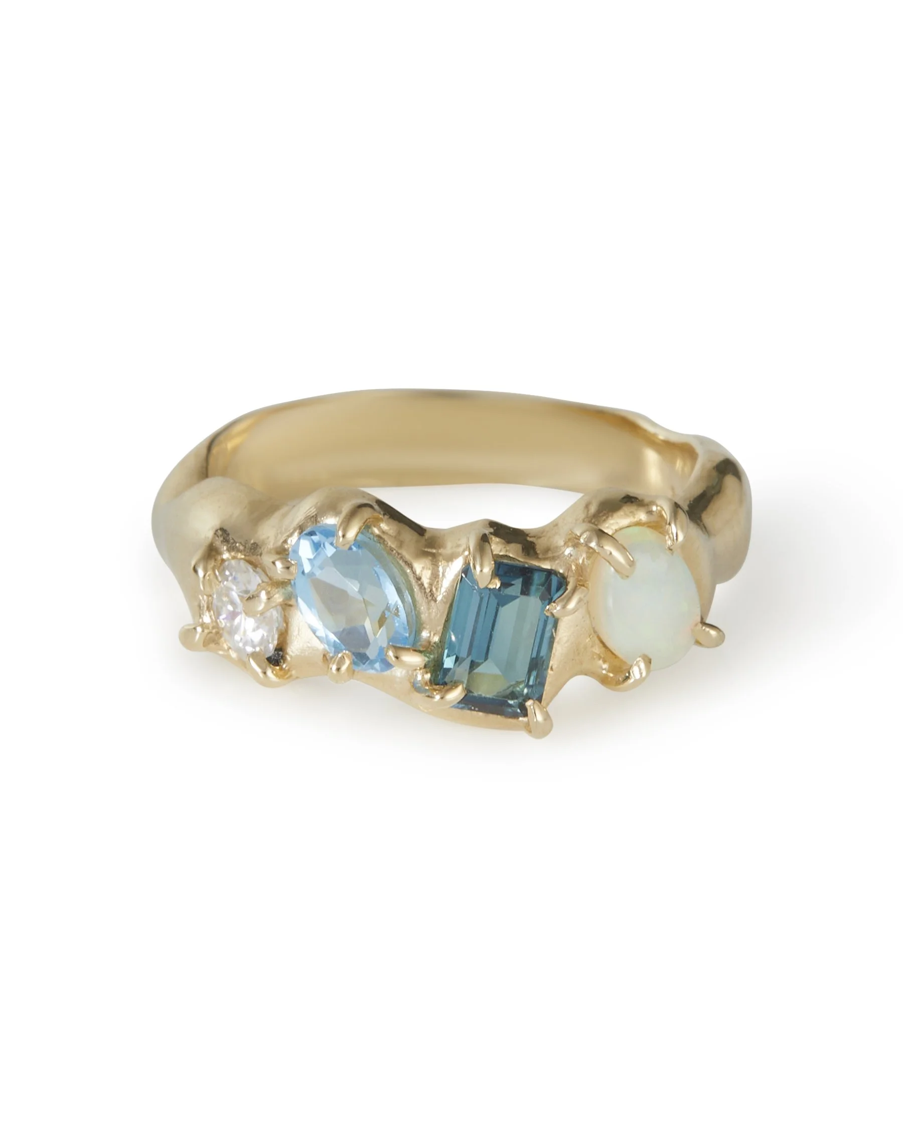A 4 stone claw set ring that is molten with blue stones and opal