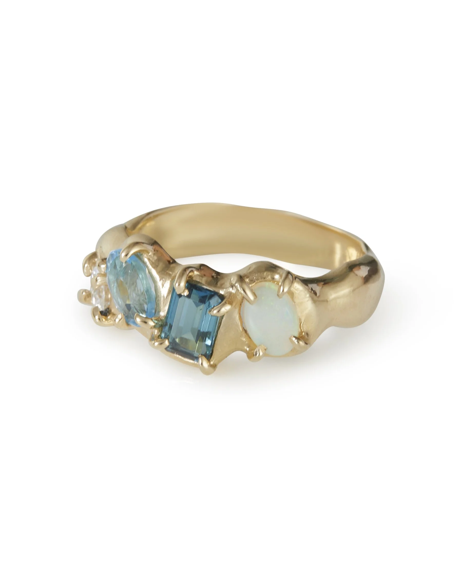 A 4 stone claw set ring that is molten with blue stones and opal