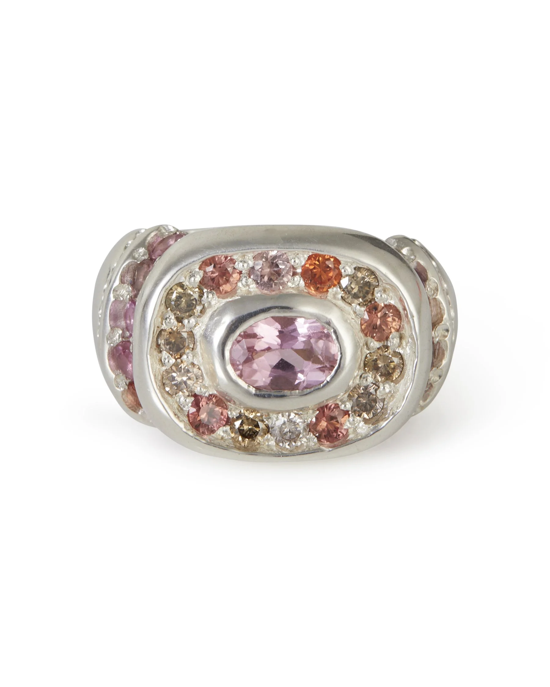 A large silver ring with brown and pink gemstones and orange side stones
