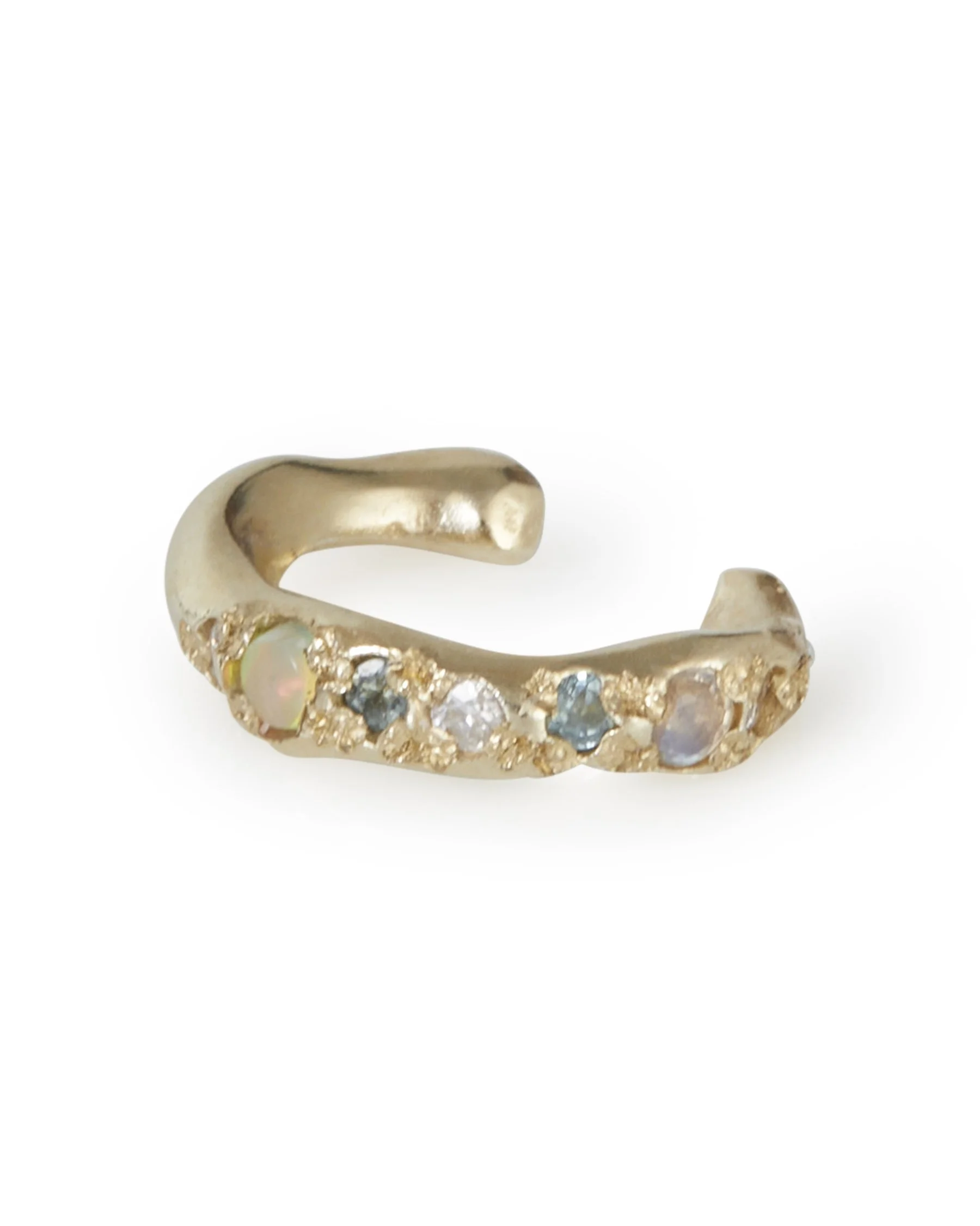 An molten ear cuff with blue toned on a white background