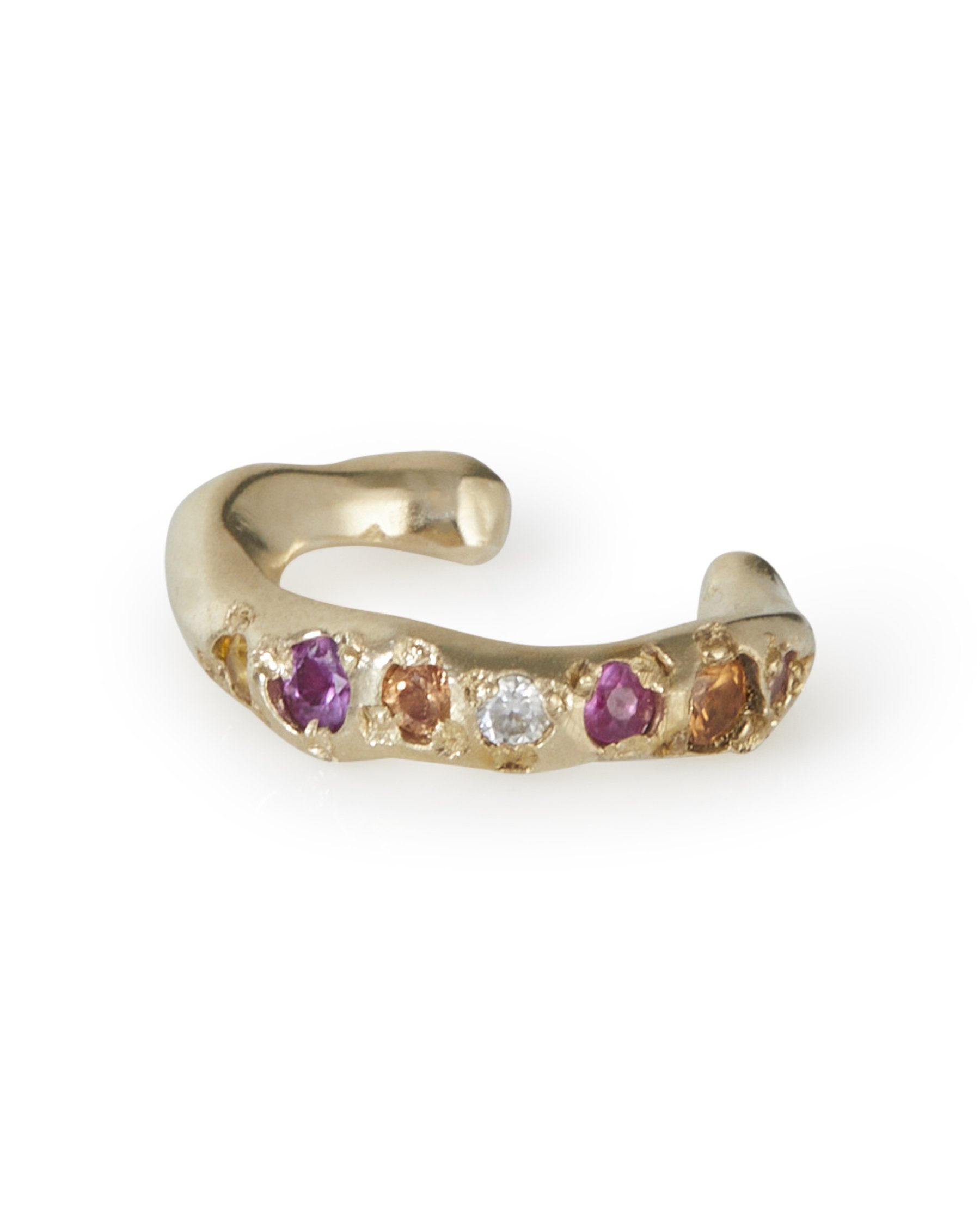 An molten ear cuff with orange pink and white stones on a white background