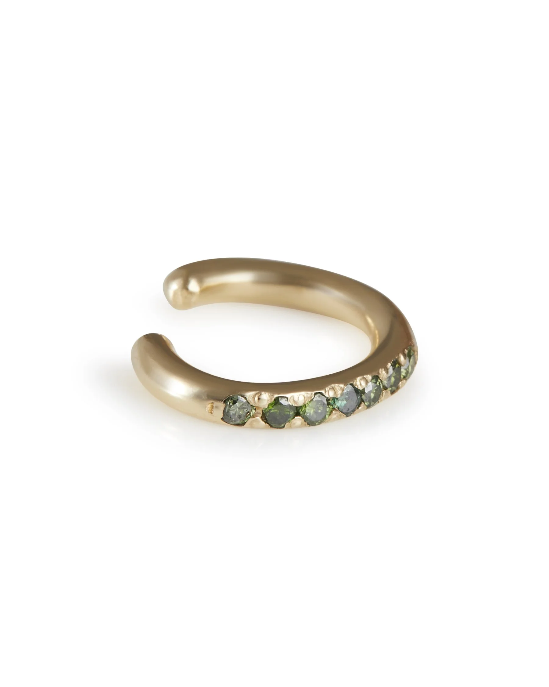A green diamond ear cuff in yellow gold on a white background