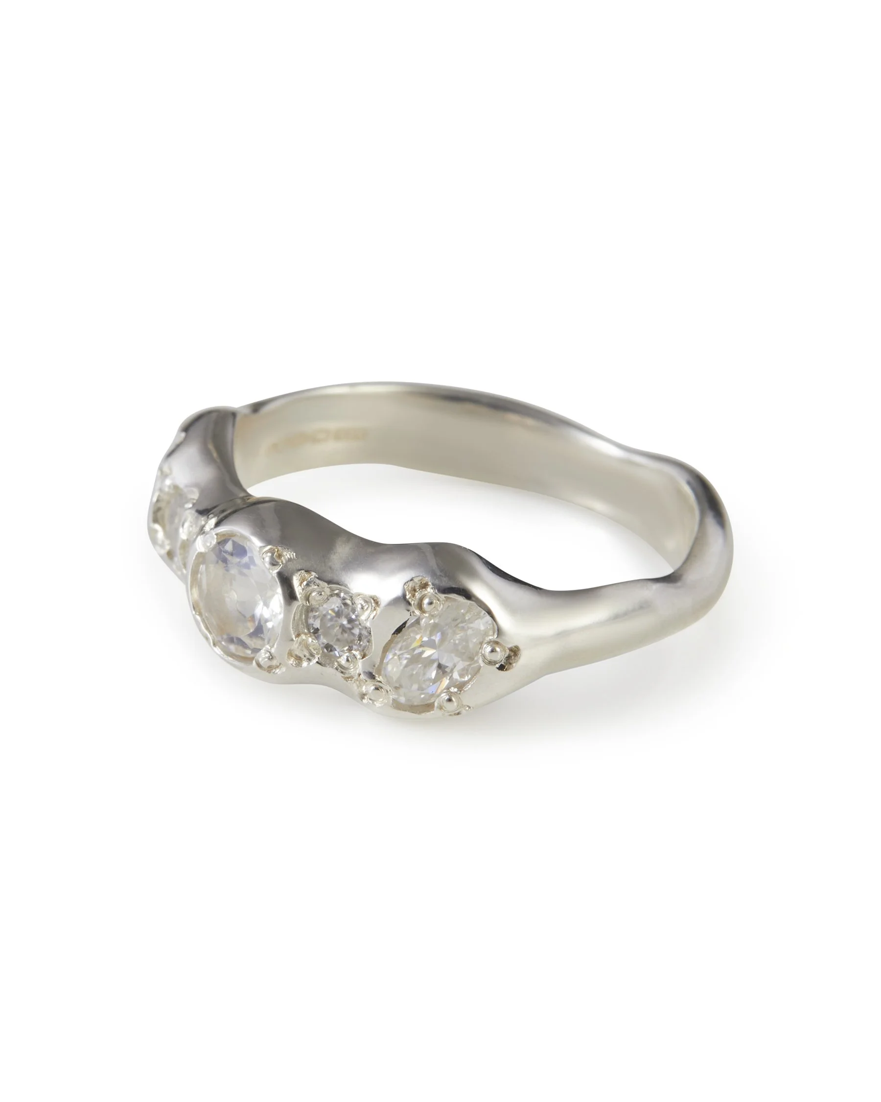 Angled view of the Moonlight Pointer Band featuring moonstone and moissanite in sterling silver.