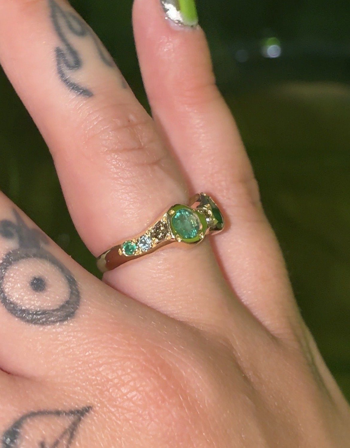 Jupiter Gold Band - a gold band with emeralds and brown diamonds