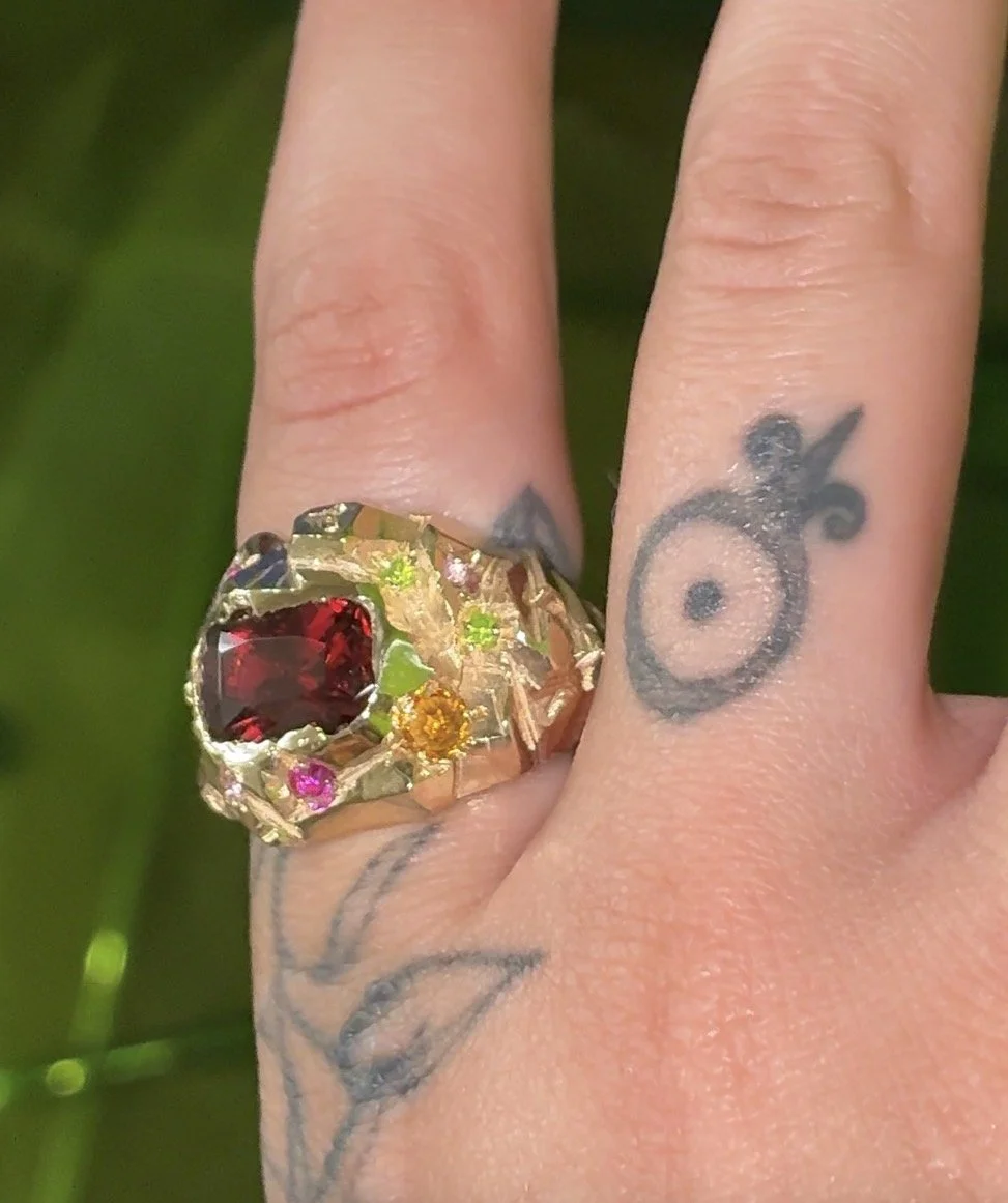Mars statement ring - a heavily textured ring with garnet, sapphire and luag