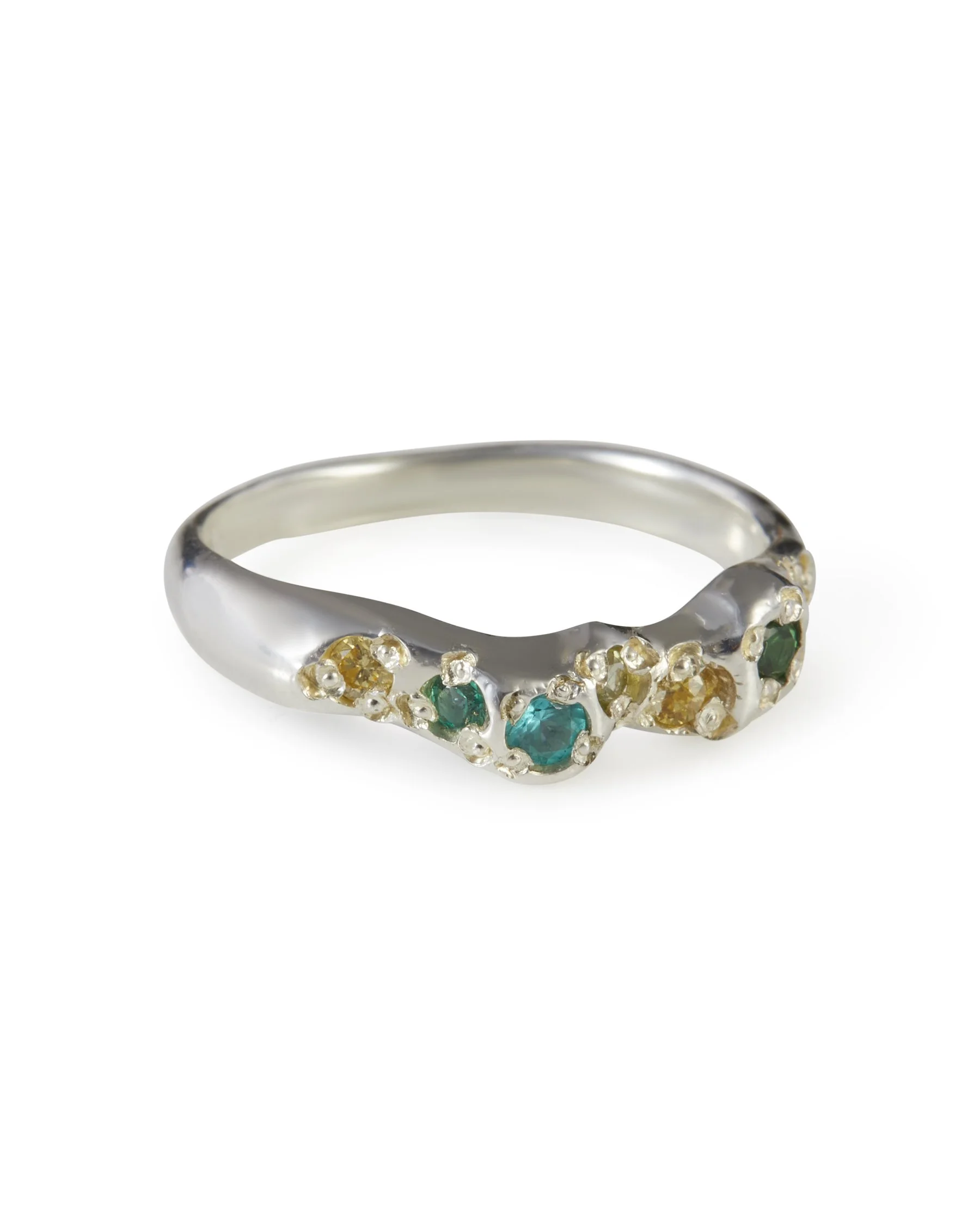 Angled view of the Miami Mini Band, a sterling silver multicolour gemstone ring with green and yellow stones.