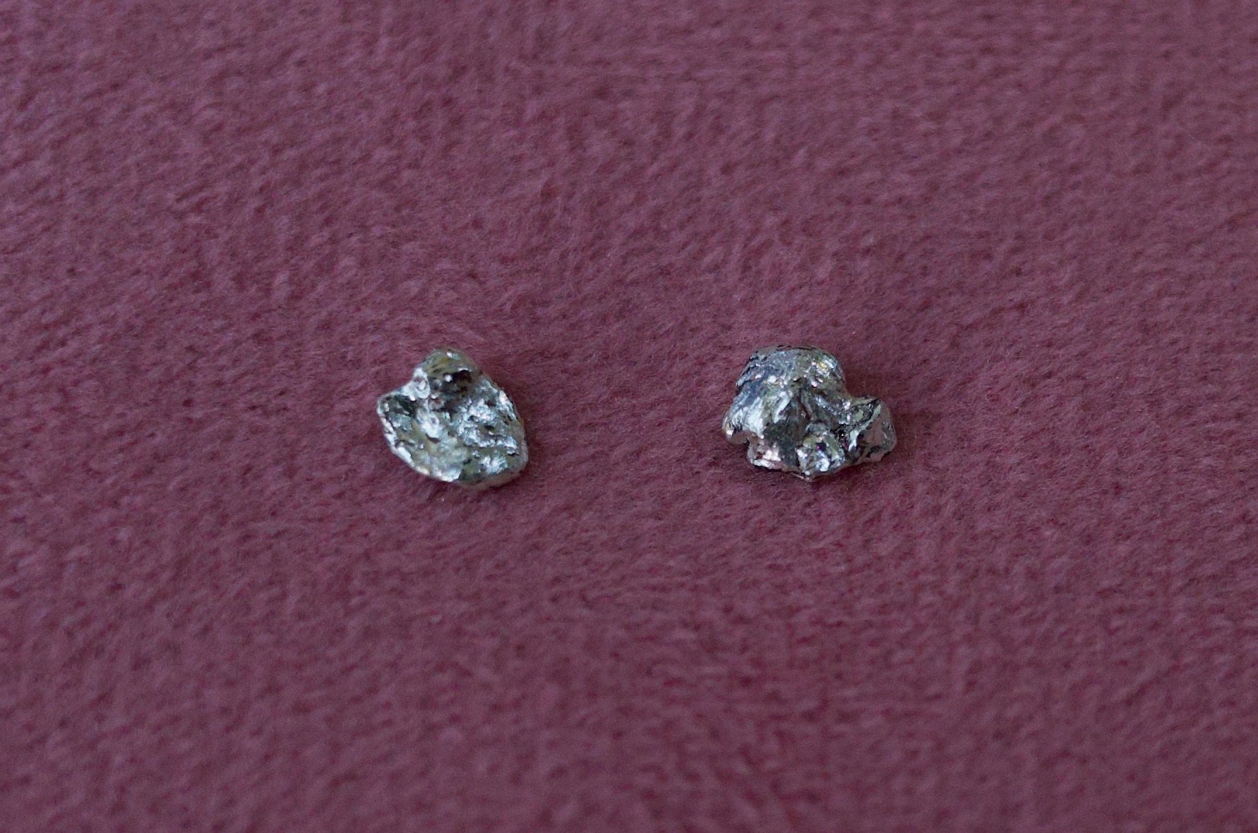 Textured sterling silver studs. The studs are mismatched