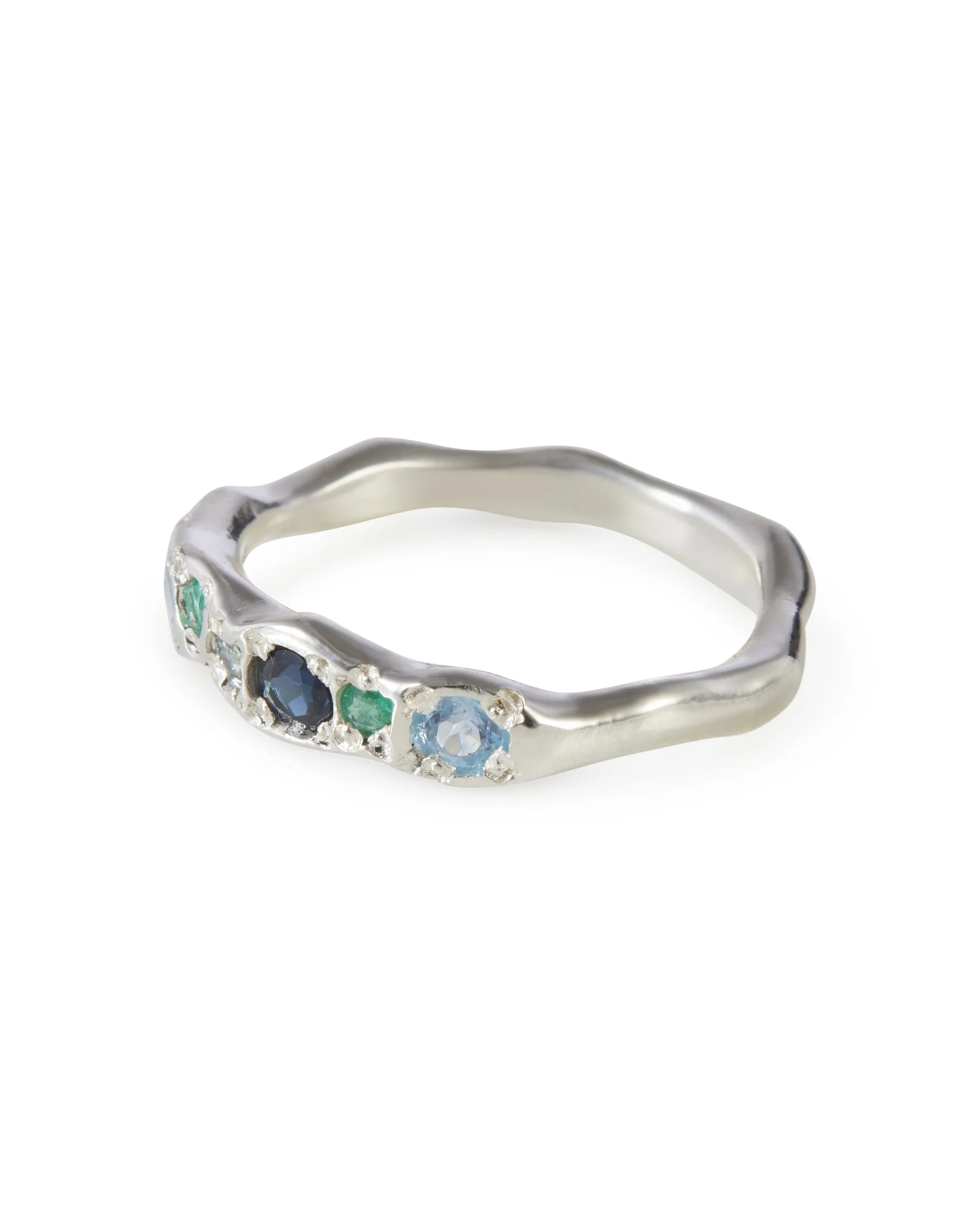 Side profile of the Menthe Colne Ring in sterling silver with blue tourmaline, blue topaz and emerald.