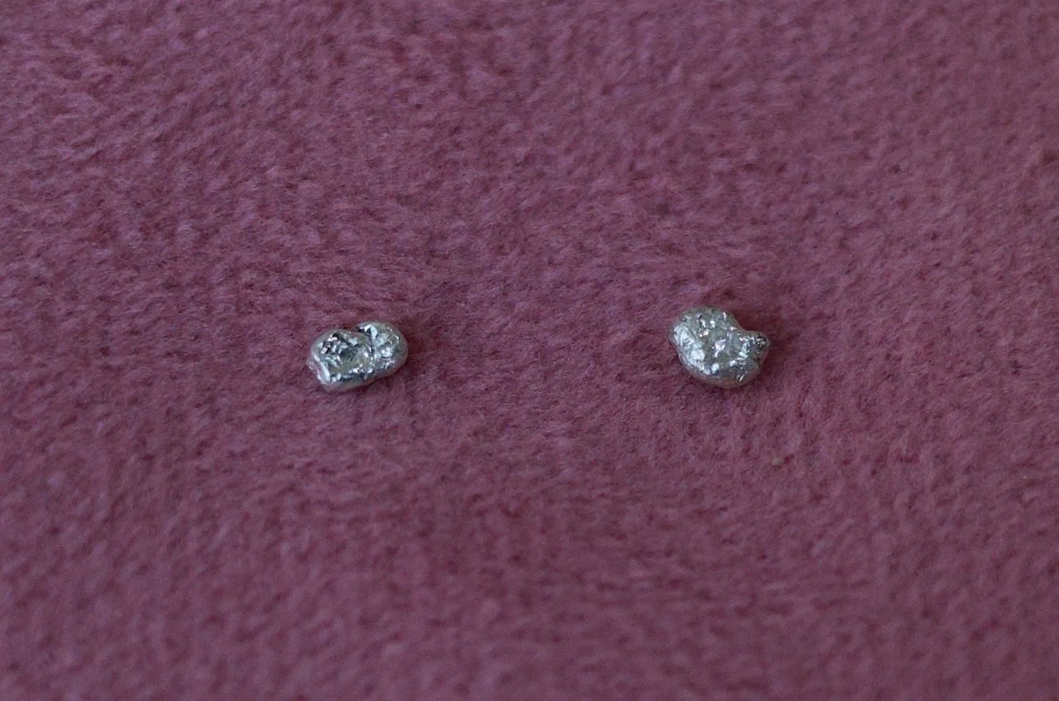 Textured sterling silver studs. The studs are mismatched