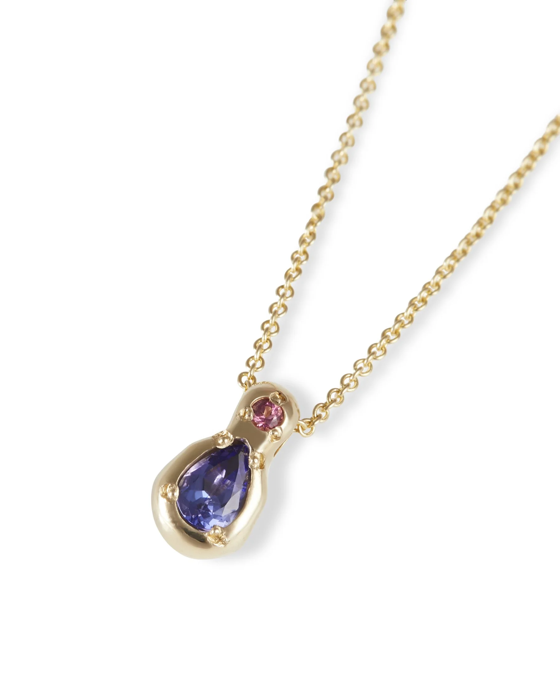 A yellow gold pear shaped pendant with blue and pink stones on a chain