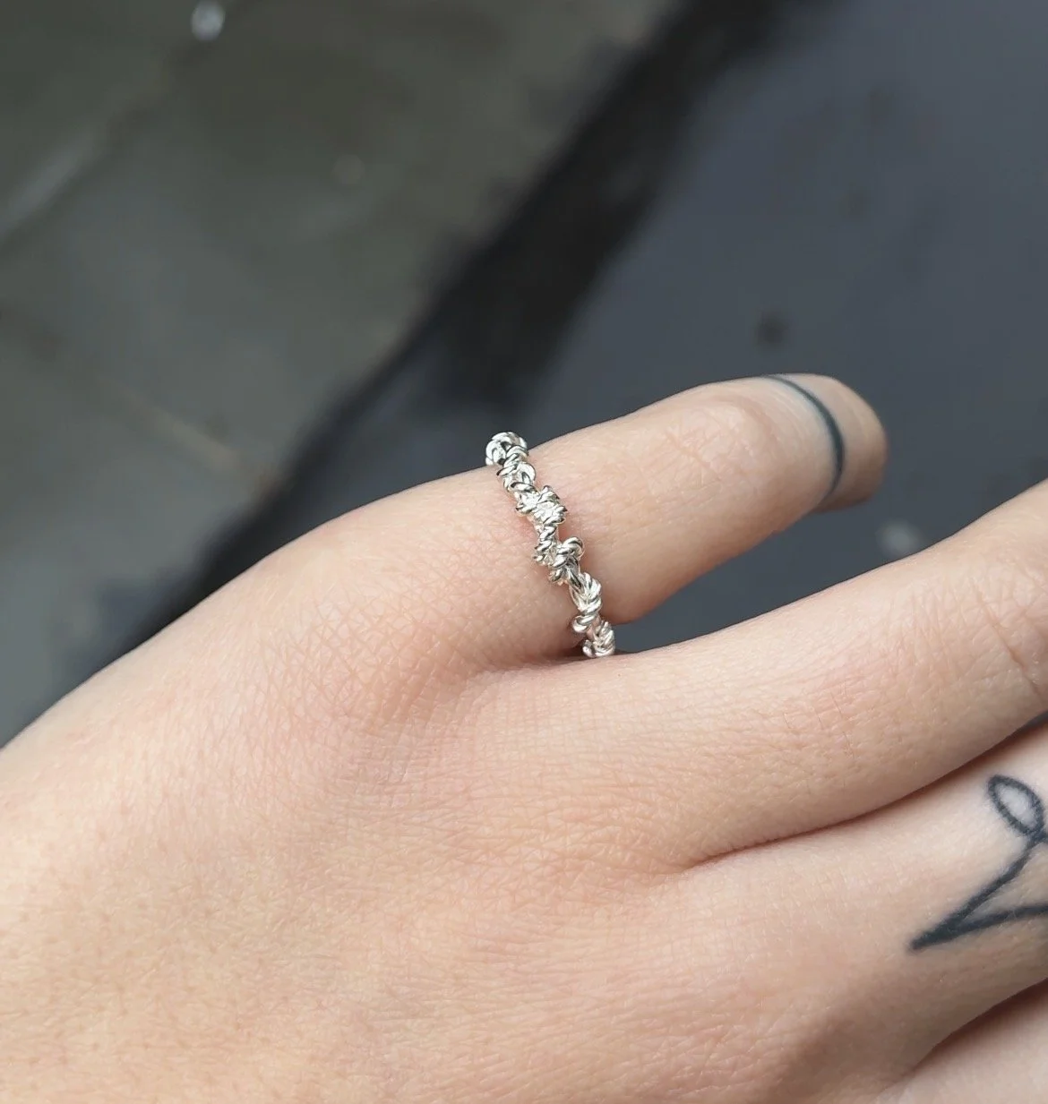 rope ring on hand