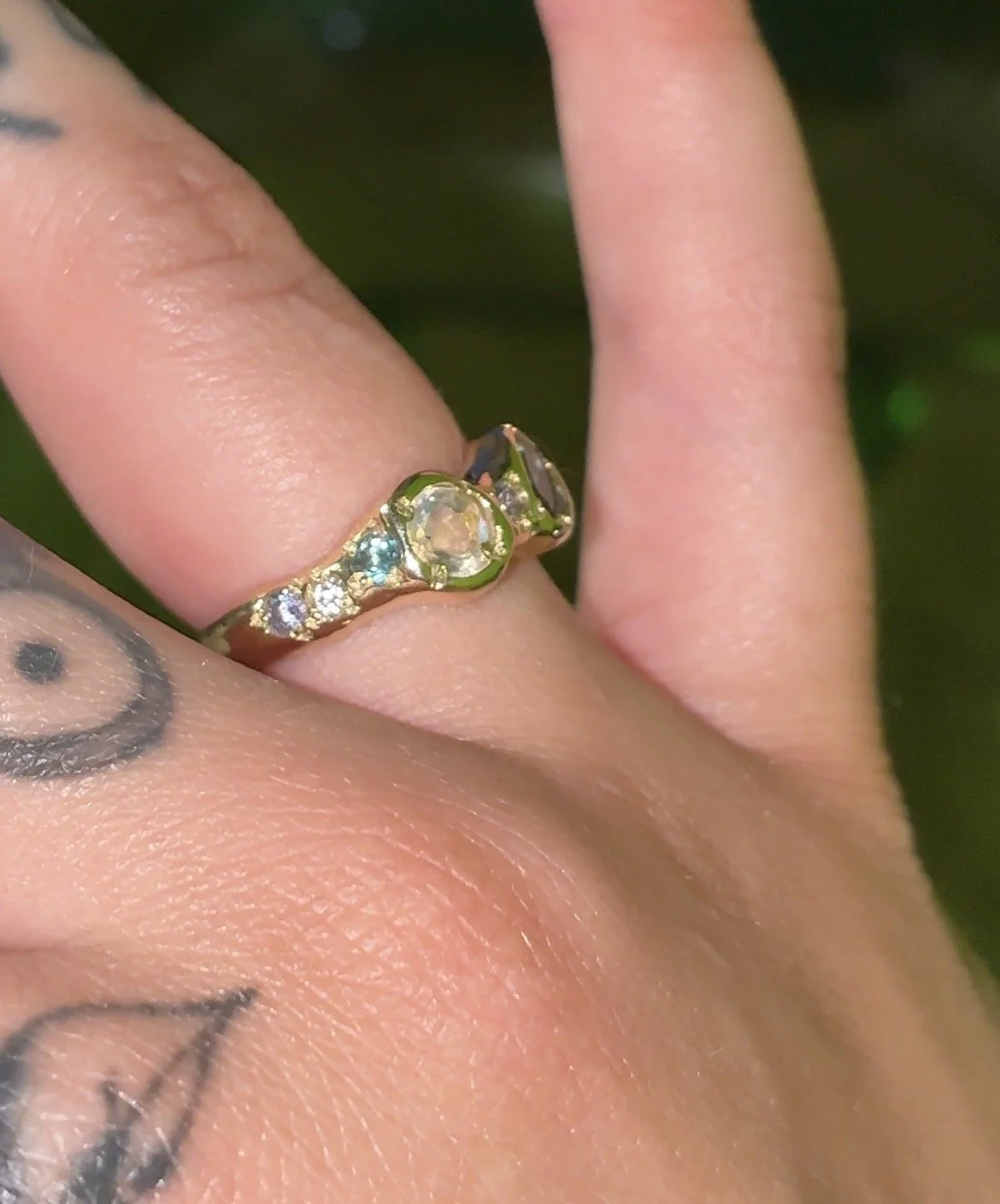 Mercury Gold band - a gold molten ring inspired by mercury with blue, purple and white stones