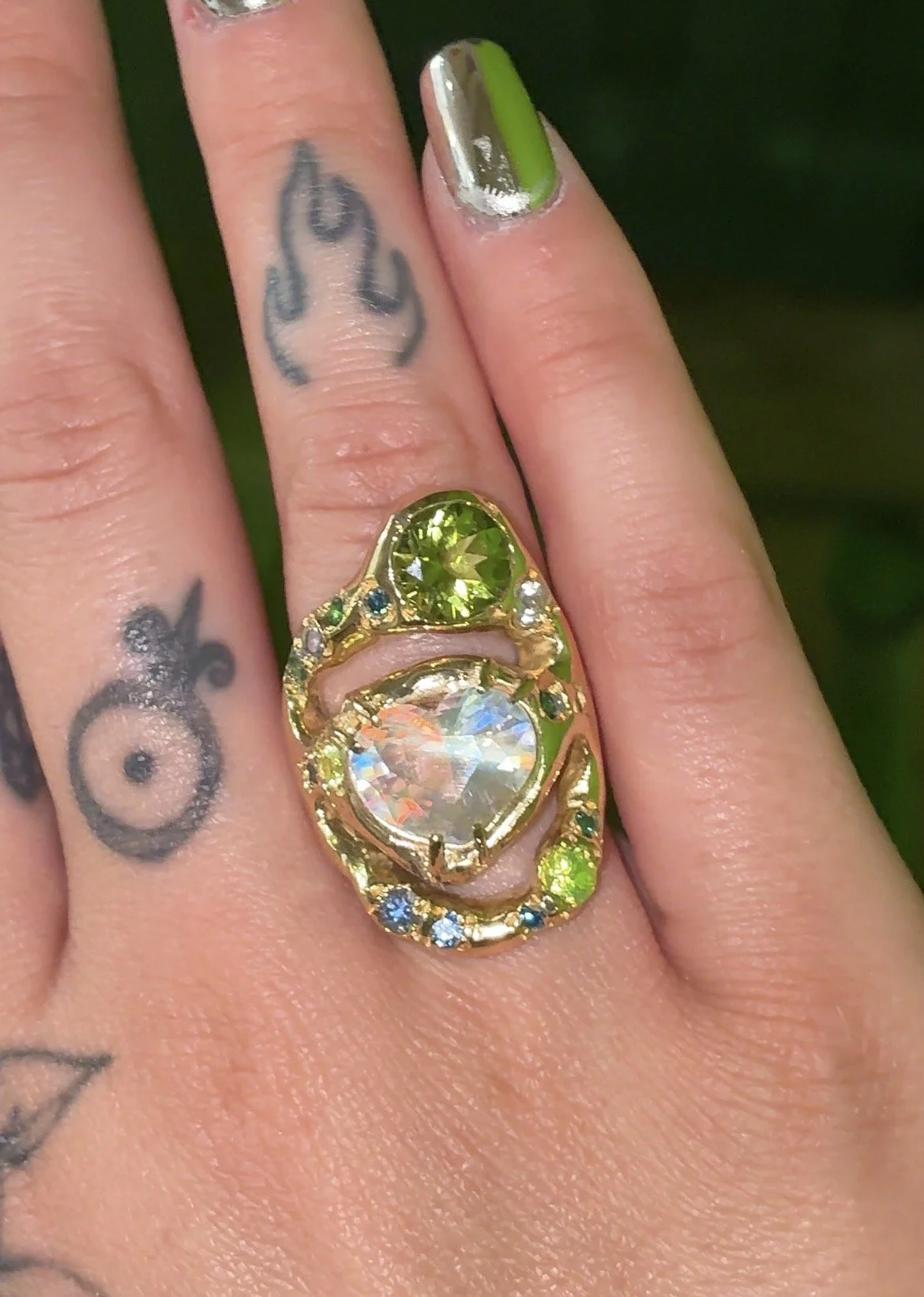Earth Statement Ring - A 3 strand ring with a central heart moonstone and green and blue gemstones in gold