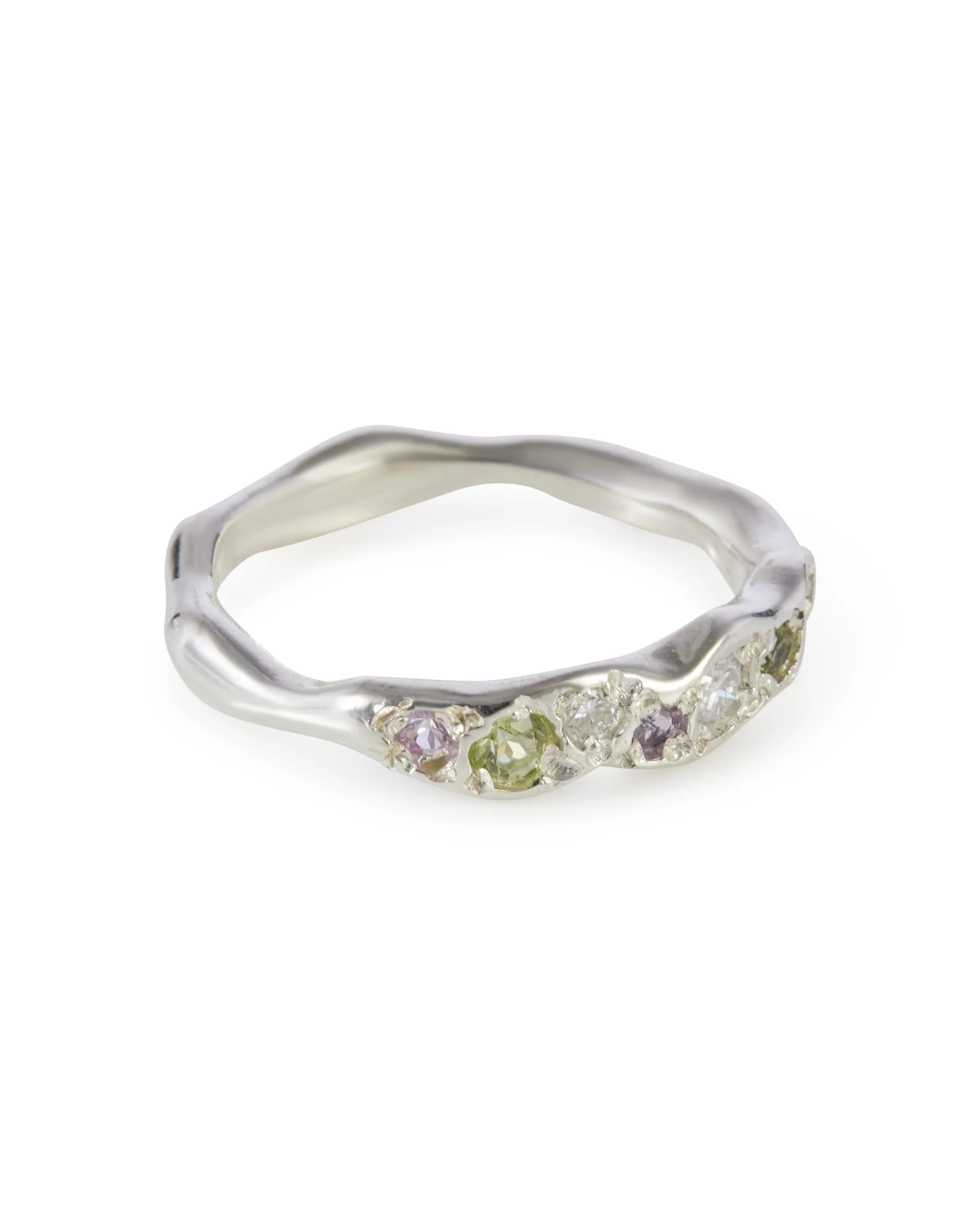 Angled view of the Petal Colne Ring featuring pink sapphire, peridot and moissanite in sterling silver.