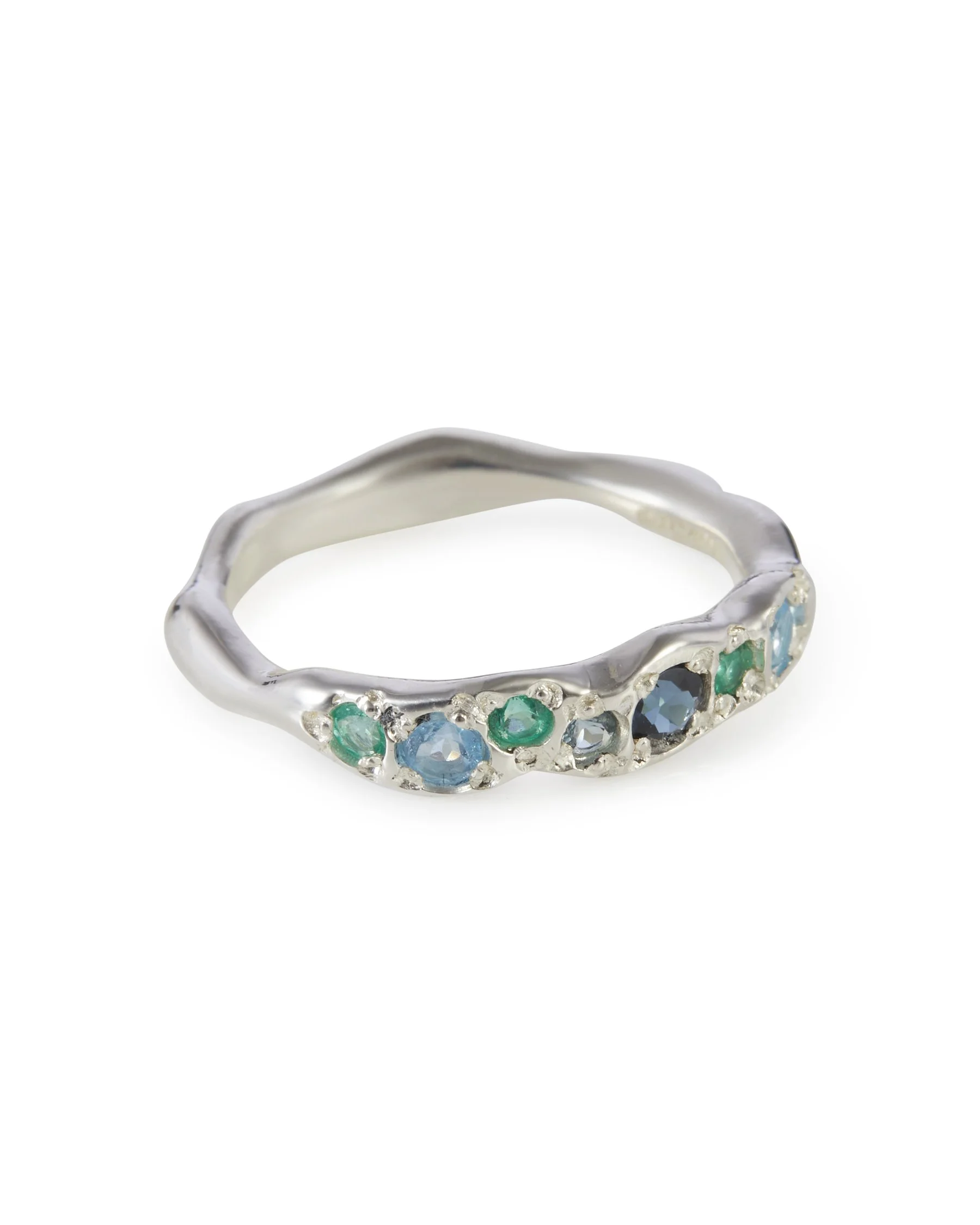 Angled view of the Menthe Colne Ring featuring blue and green gemstones including tourmaline, topaz and emerald.