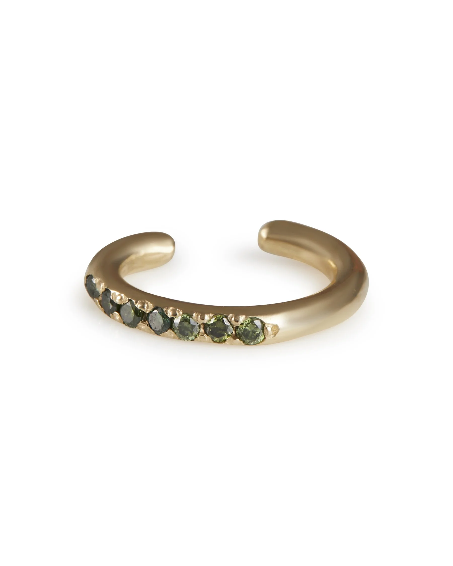 A green diamond ear cuff in yellow gold on a white background