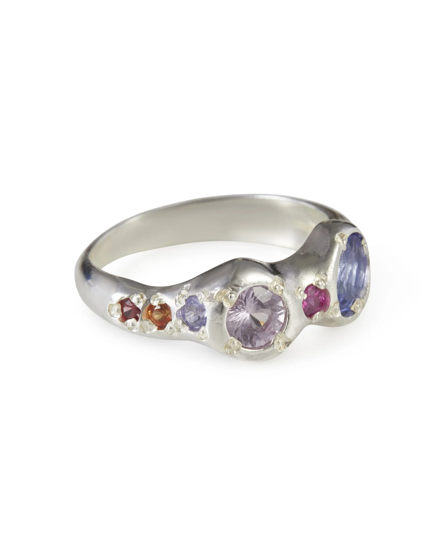 Angled view of the Princess Power Alien Eyes Ring featuring colourful sapphires and tanzanite in sterling silver.