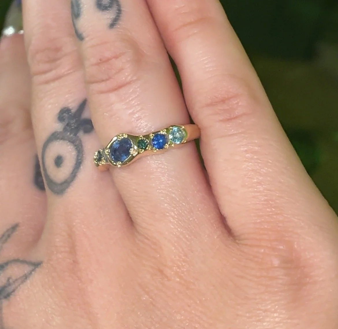 Neptune Band Gold - a gold molten band with blue diamonds, topaz and sapphire