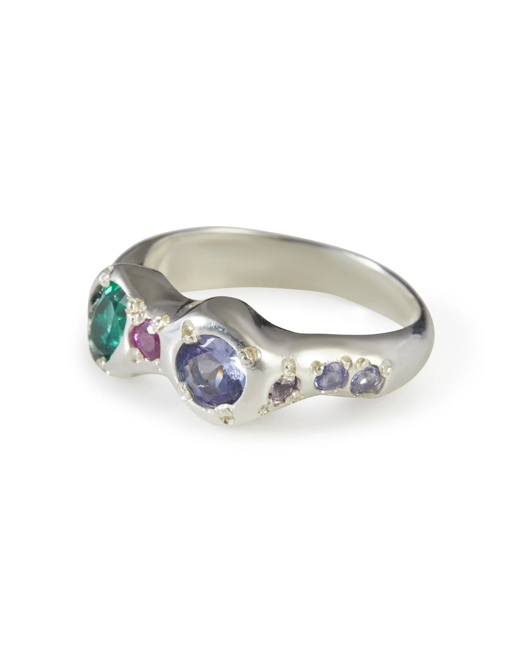 Side profile of the Jester Alien Eyes Ring with pink sapphire, purple sapphire, tanzanite and lab grown emerald.